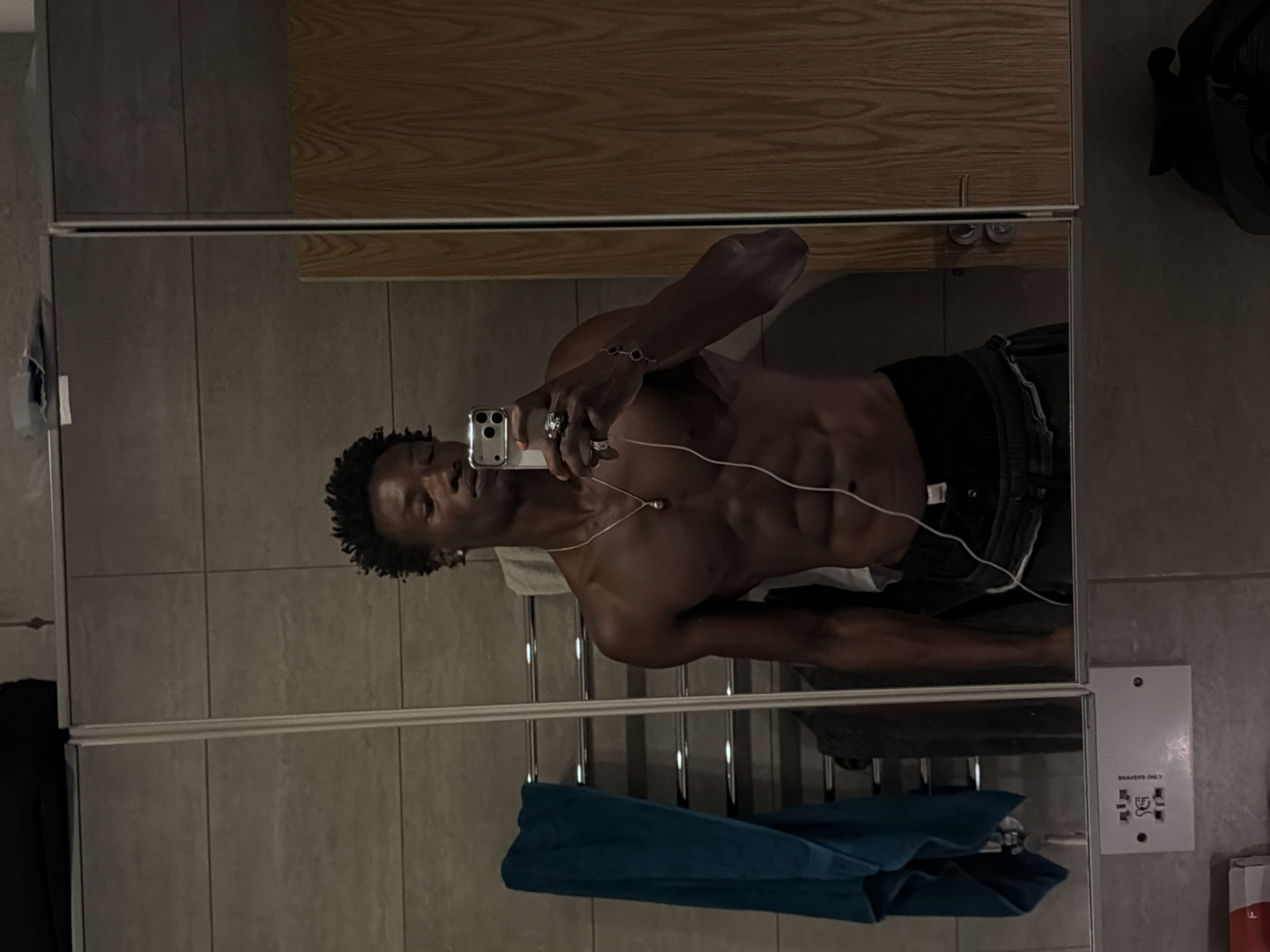 Late-night bathroom mirror selfie in London.