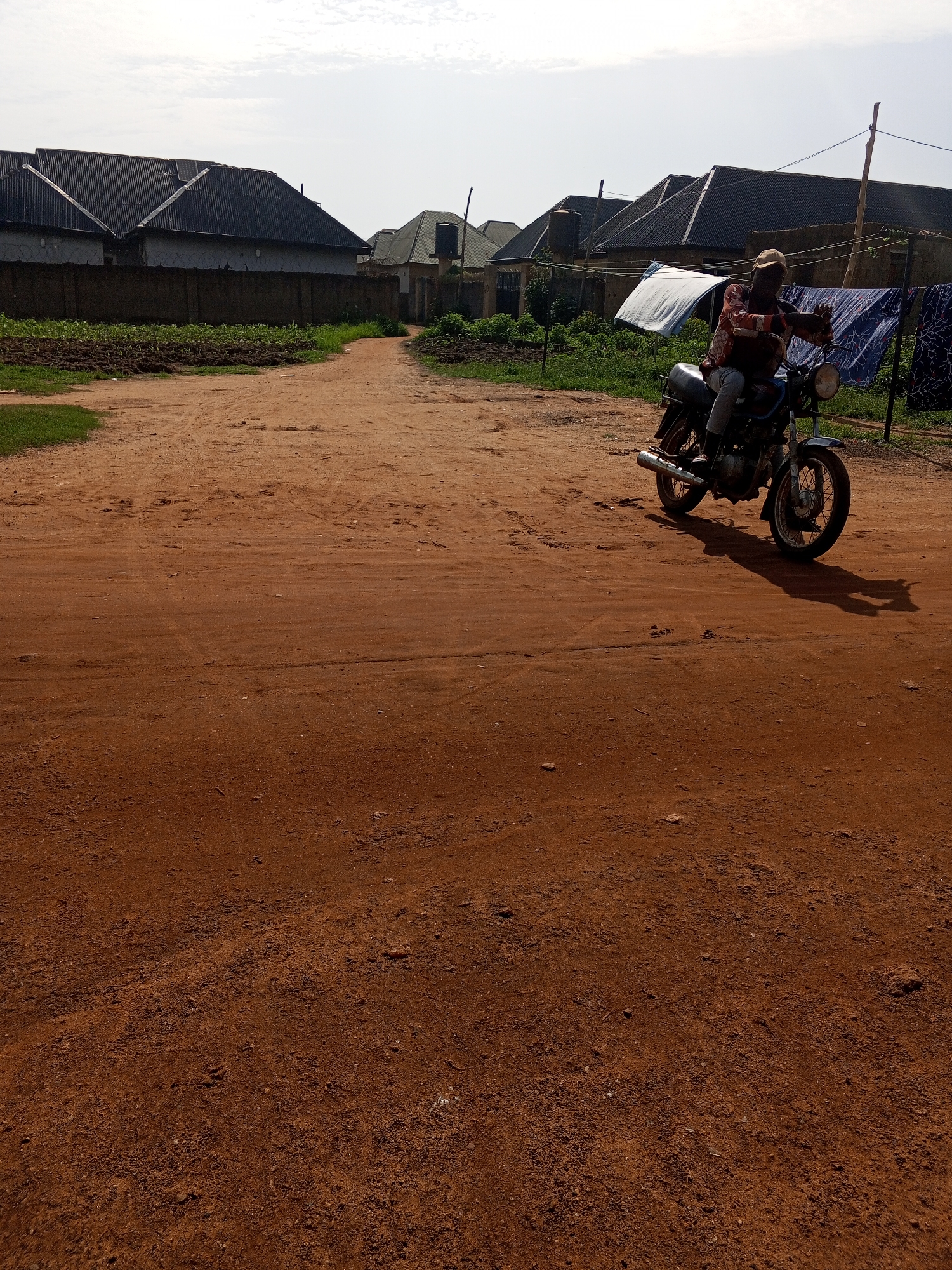 Daily life unfolds on Abuja's dirt roads