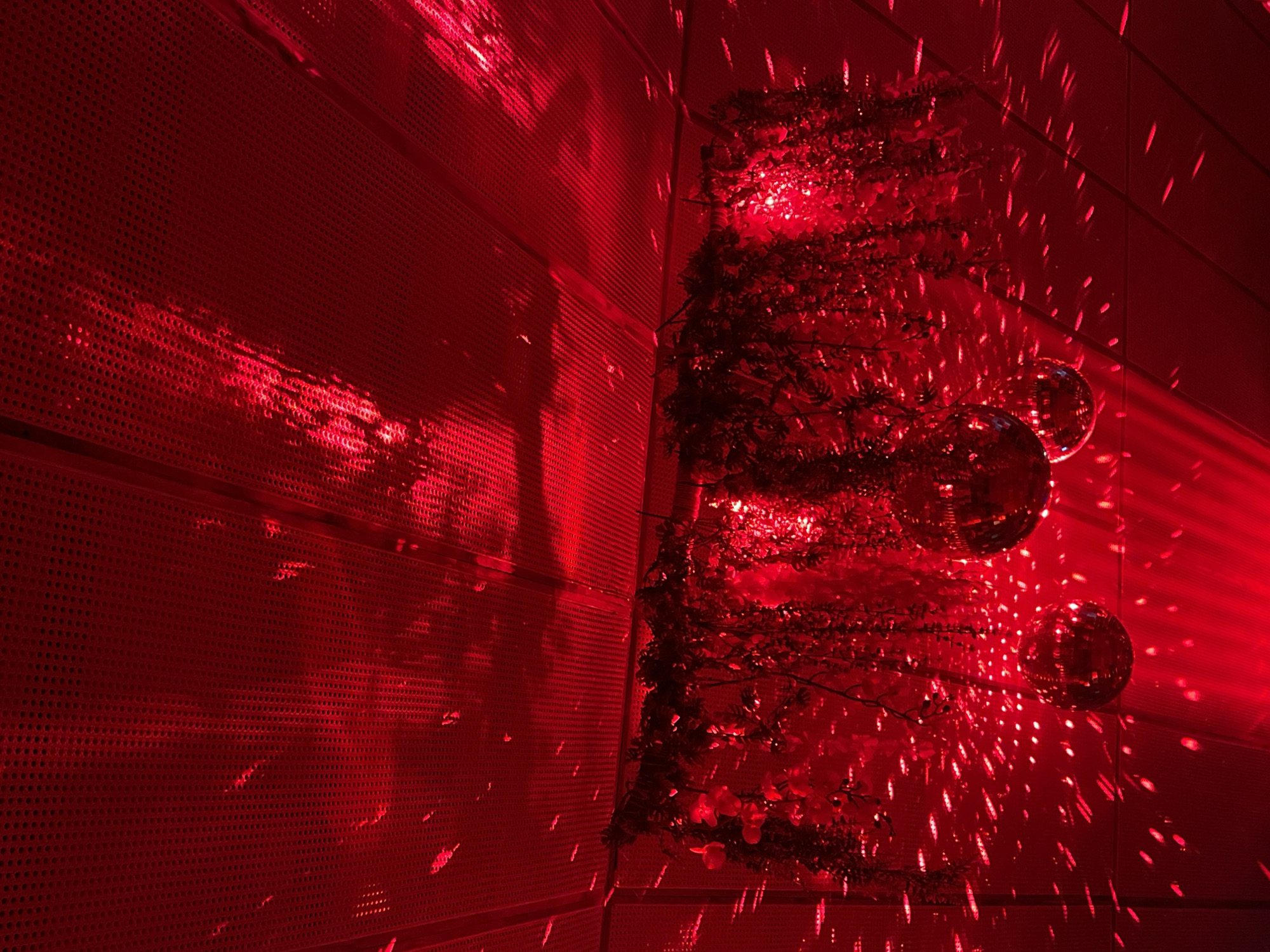 Red-lit interior with disco balls captured in Thailand