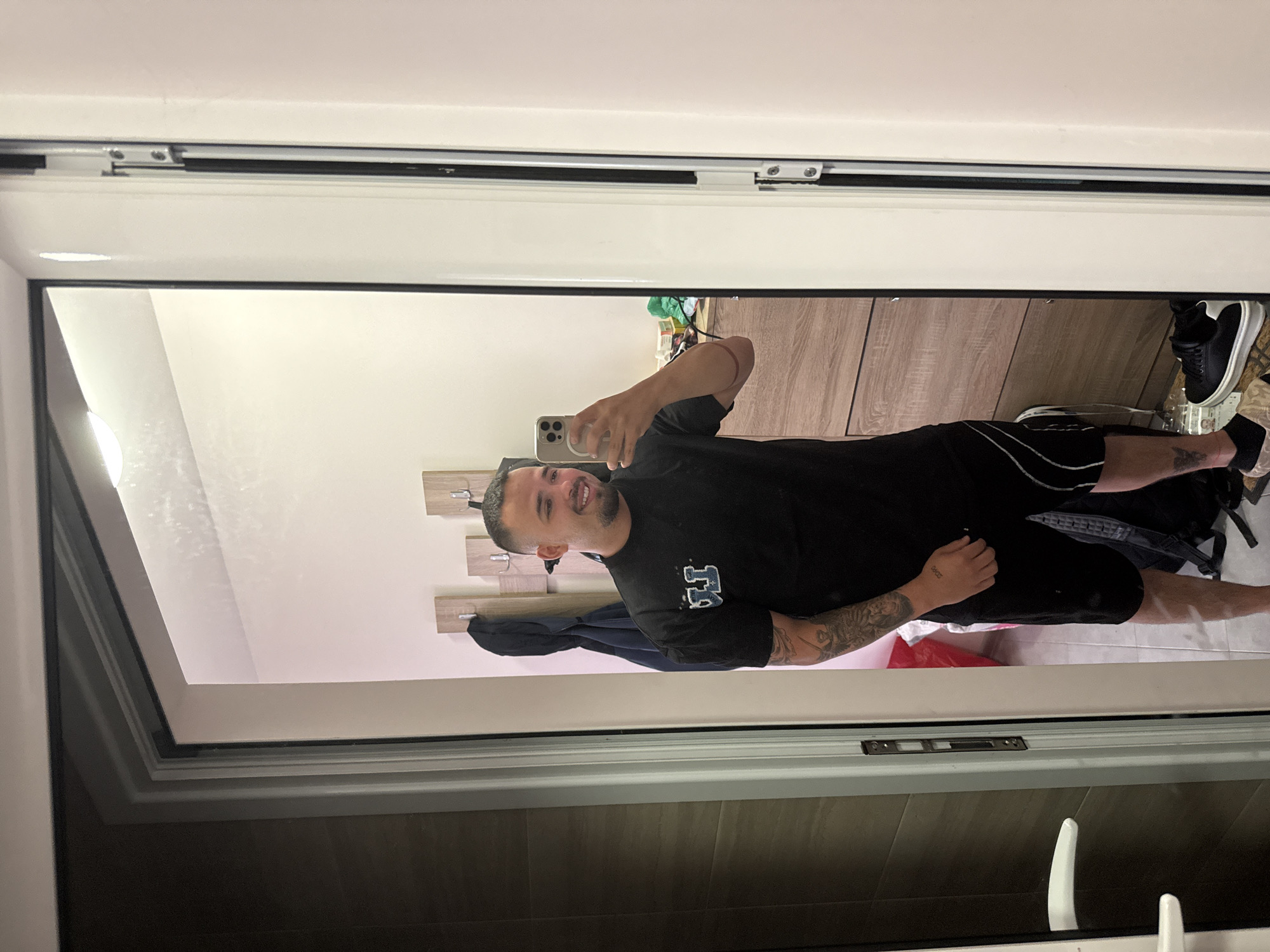 Person takes mirror selfies wearing shark slippers in Blagoevgrad