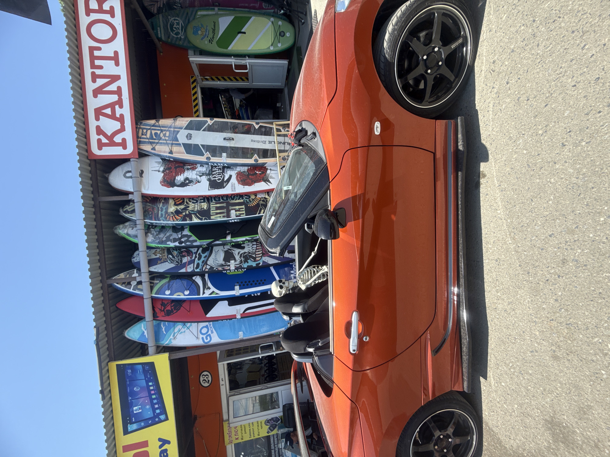 Skeleton figure spotted in orange convertible outside Vladivostok surf shop