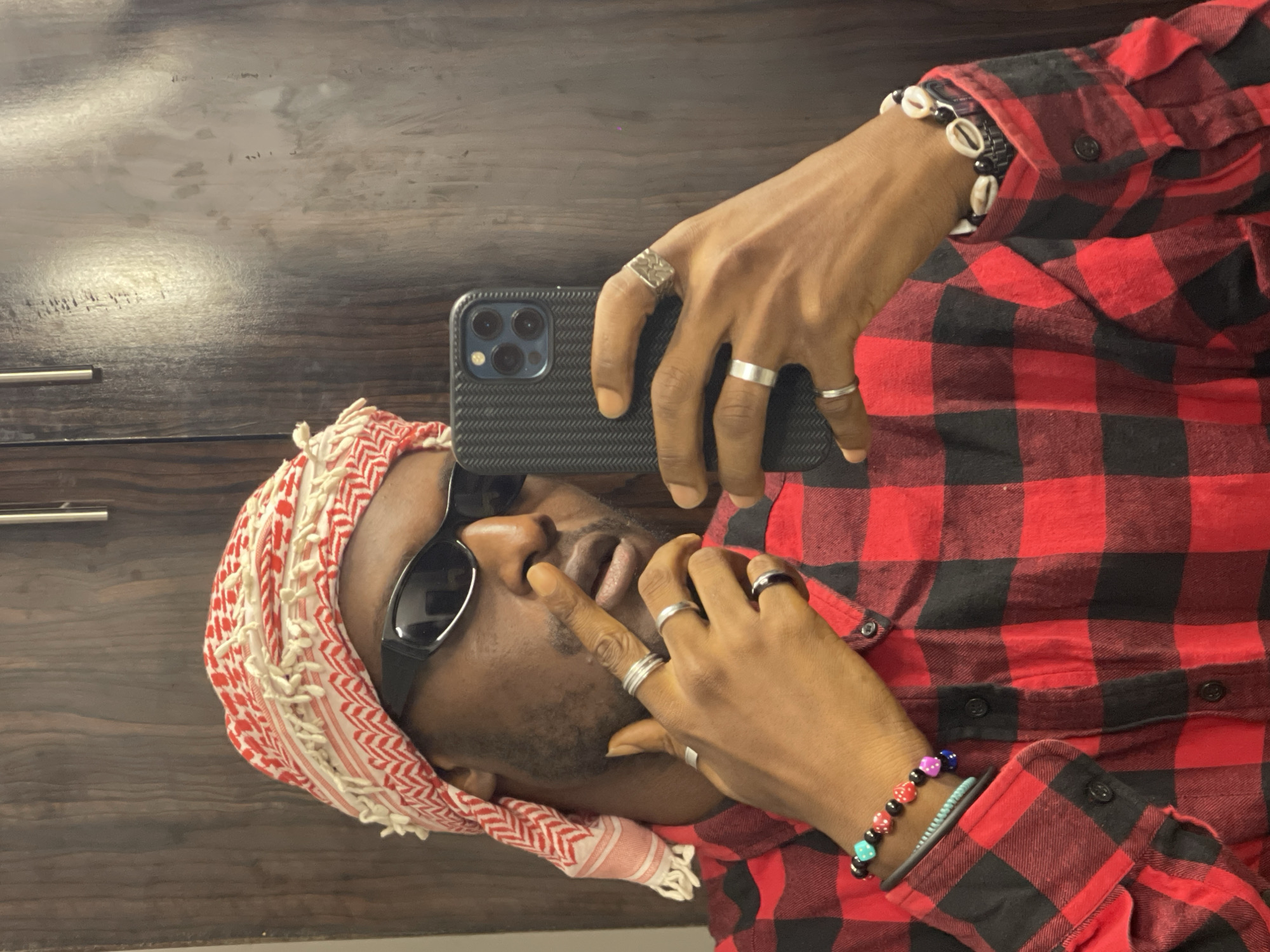 Quick selfie session in Abuja, consistent outfit, indoor setting.
