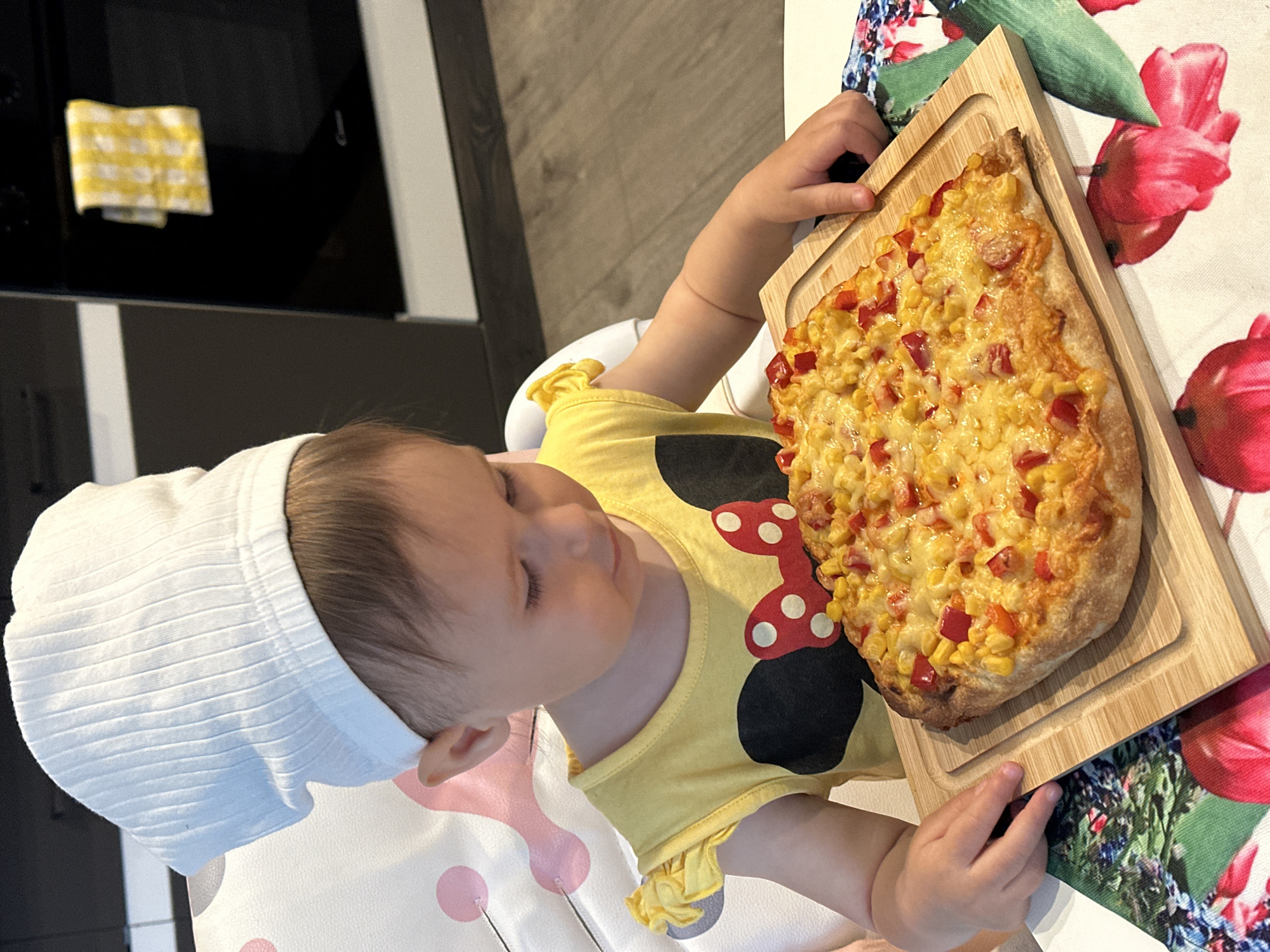 Toddler with wooden board captured in Wisła dining moment