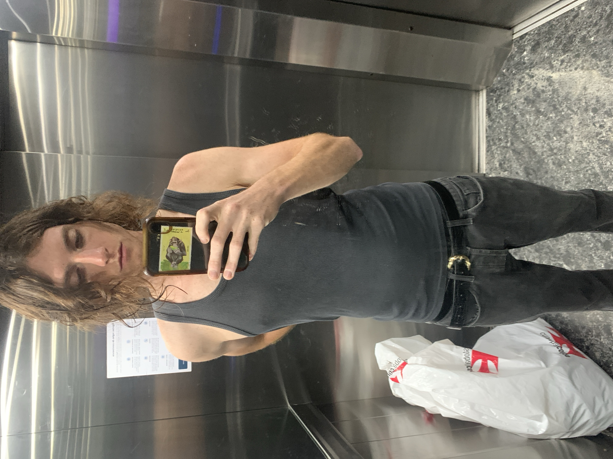 Person documents evening routine in Buenos Aires elevator, bathroom
