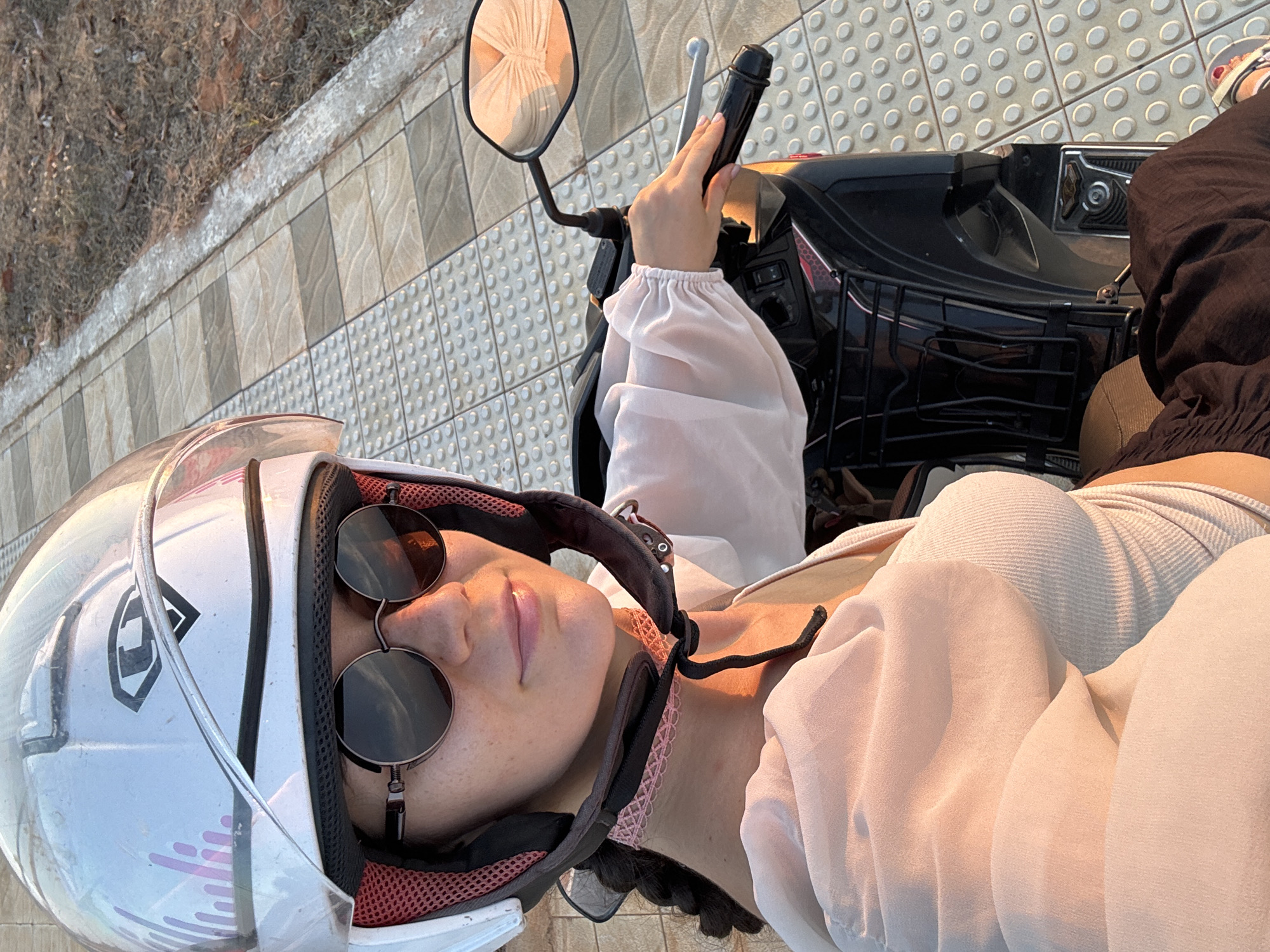 Woman photographed on scooter in Mũi Né, Vietnam