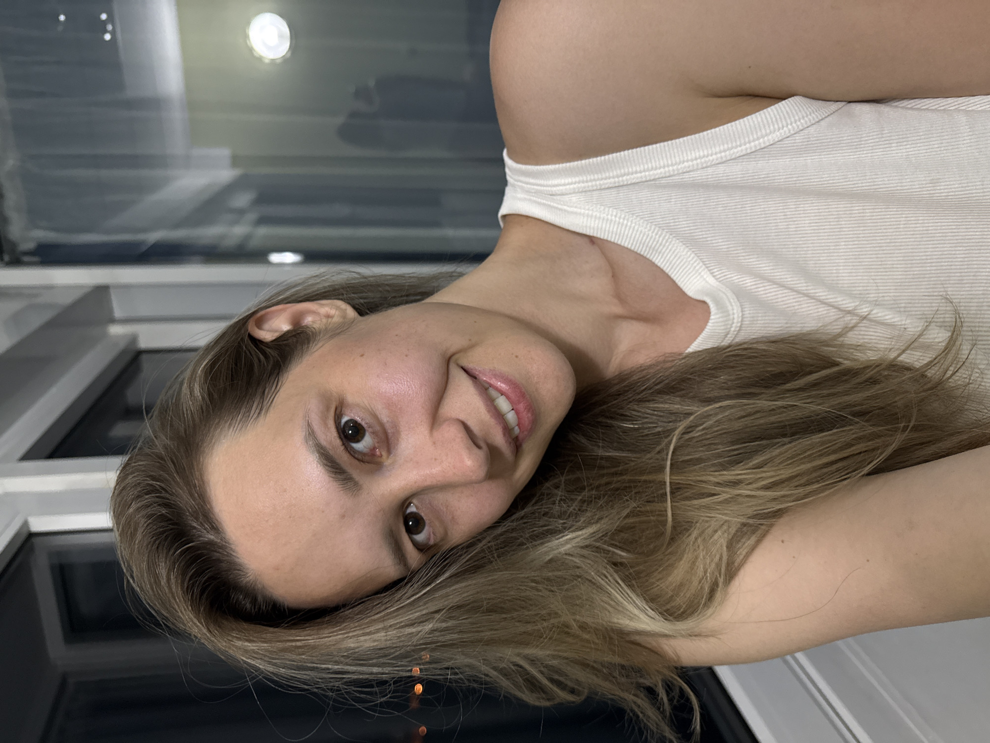 Woman takes selfie on balcony in Nebug, Russia