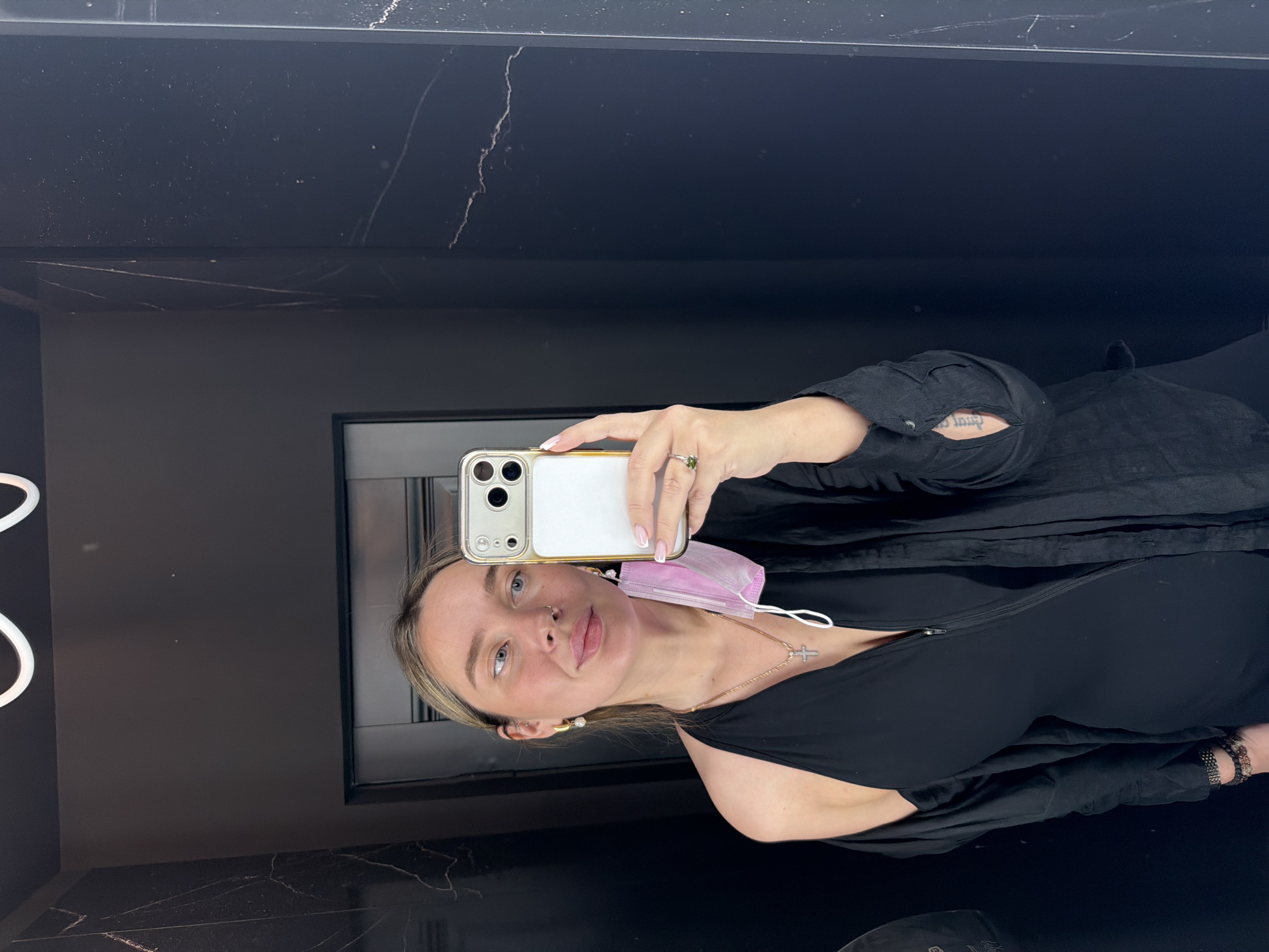 Woman takes mirror selfie with smartphone in Moscow