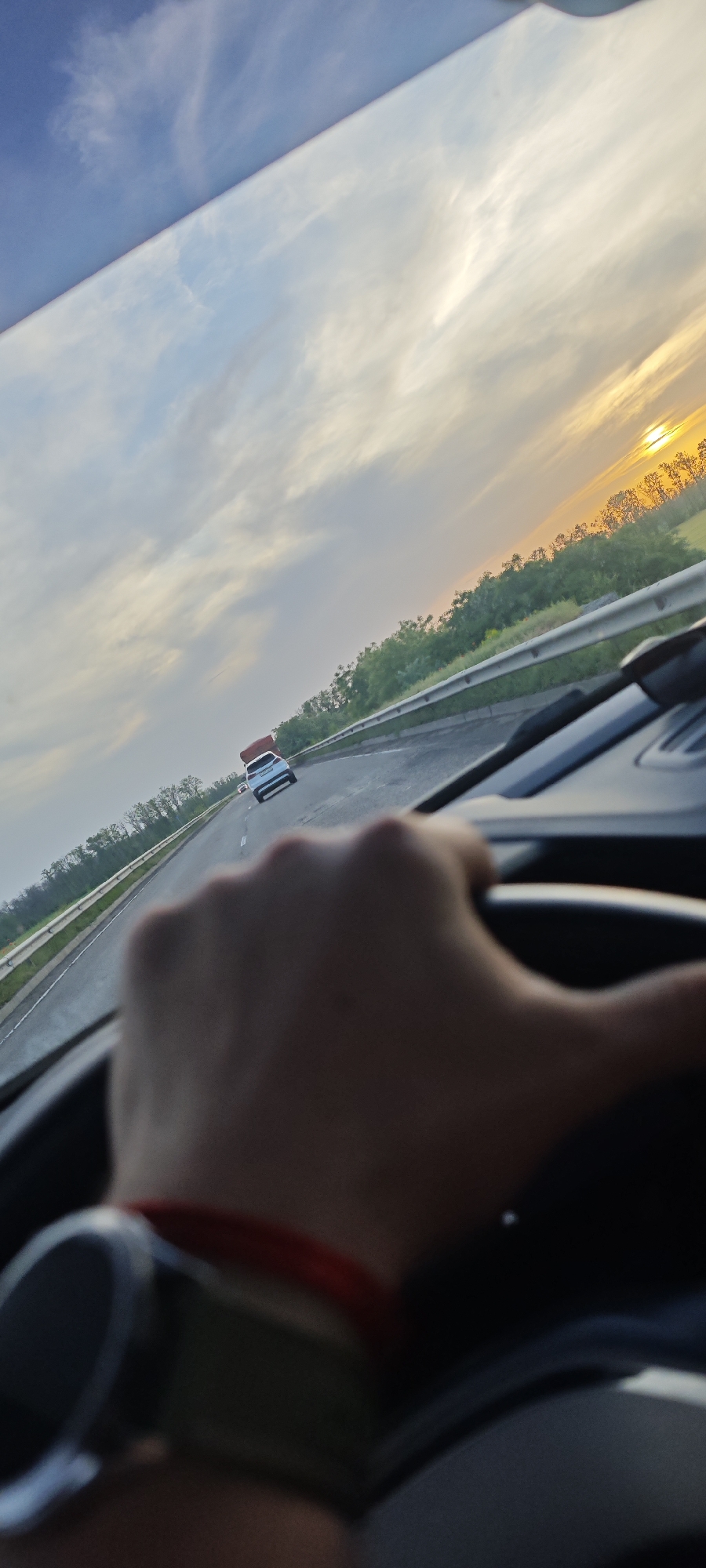 Driver travels highway near Tikhoretsk with navigation active