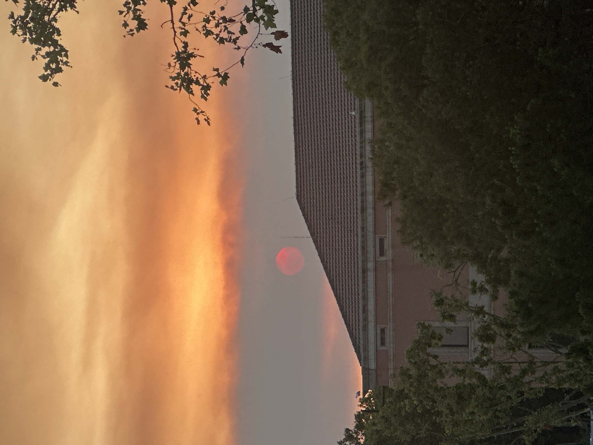 Wildfire smoke turns Barcelona's sky deep red at sunset