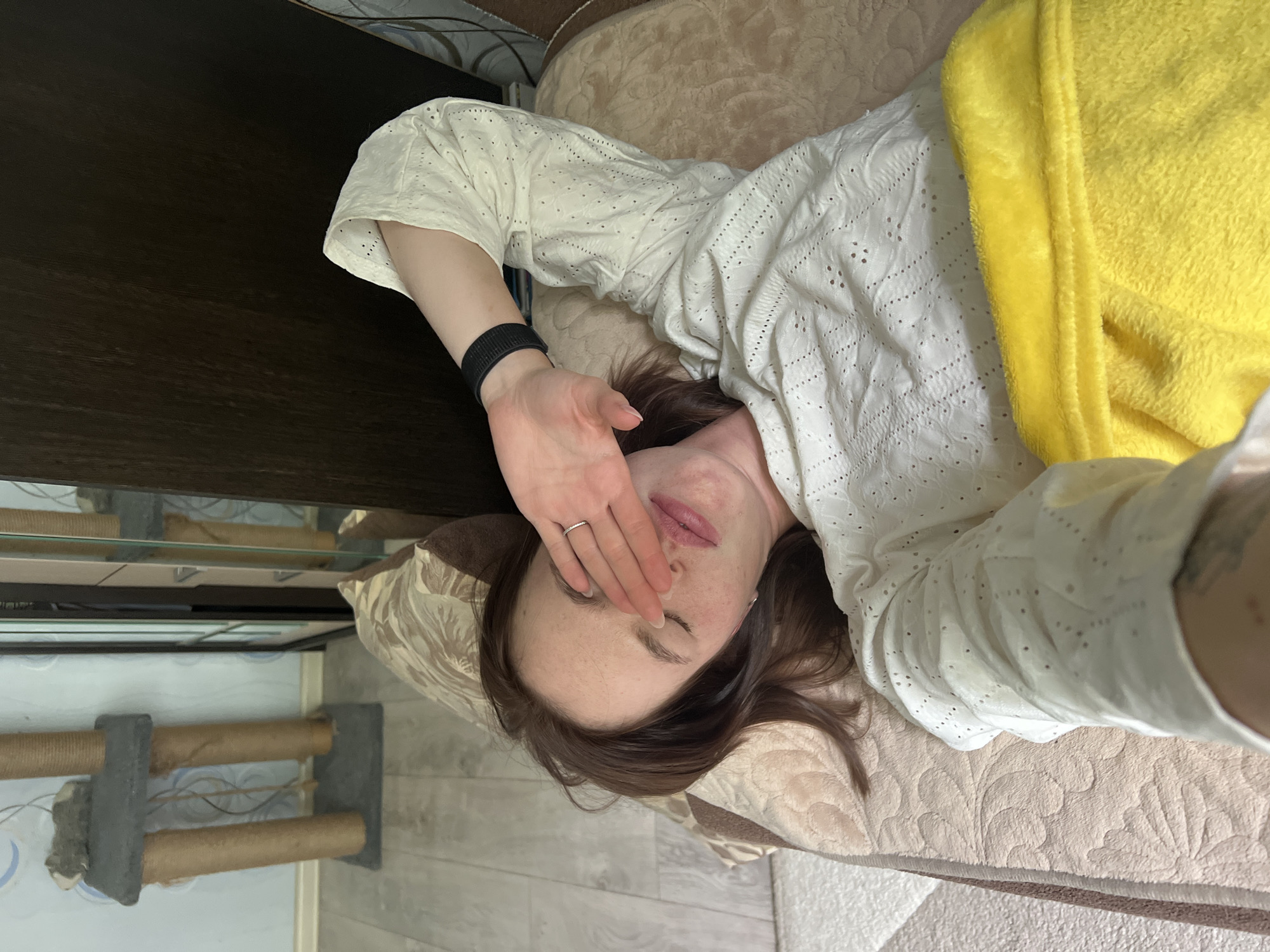 Woman resting on bed observed in Chaikovsky, Russia