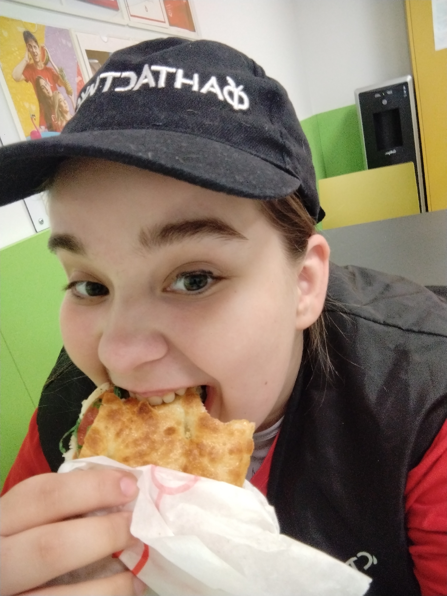 Young person enjoys sandwich meal in Plovdiv, Bulgaria