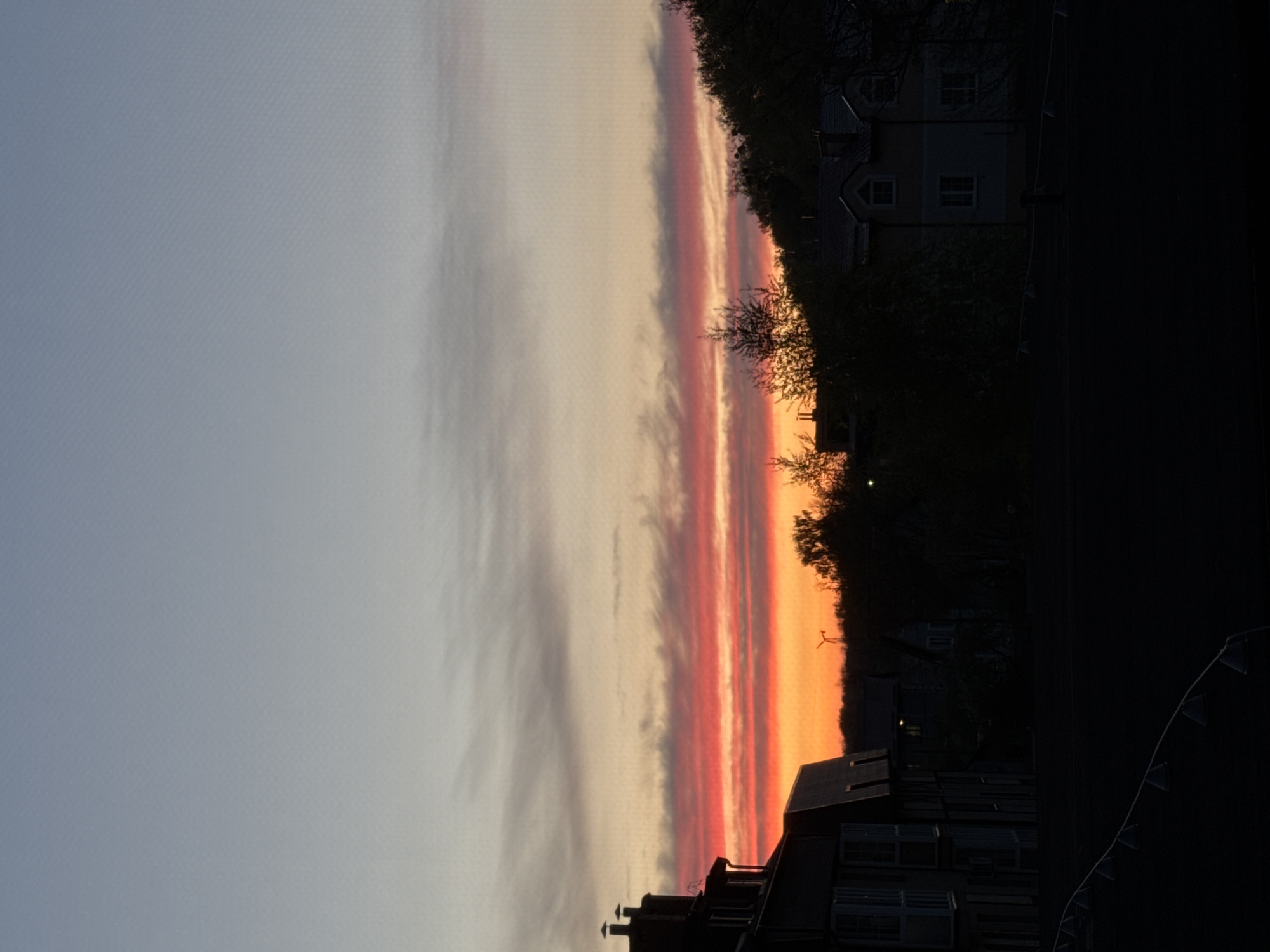 Sunset observed over residential Kaliningrad with vibrant orange skies