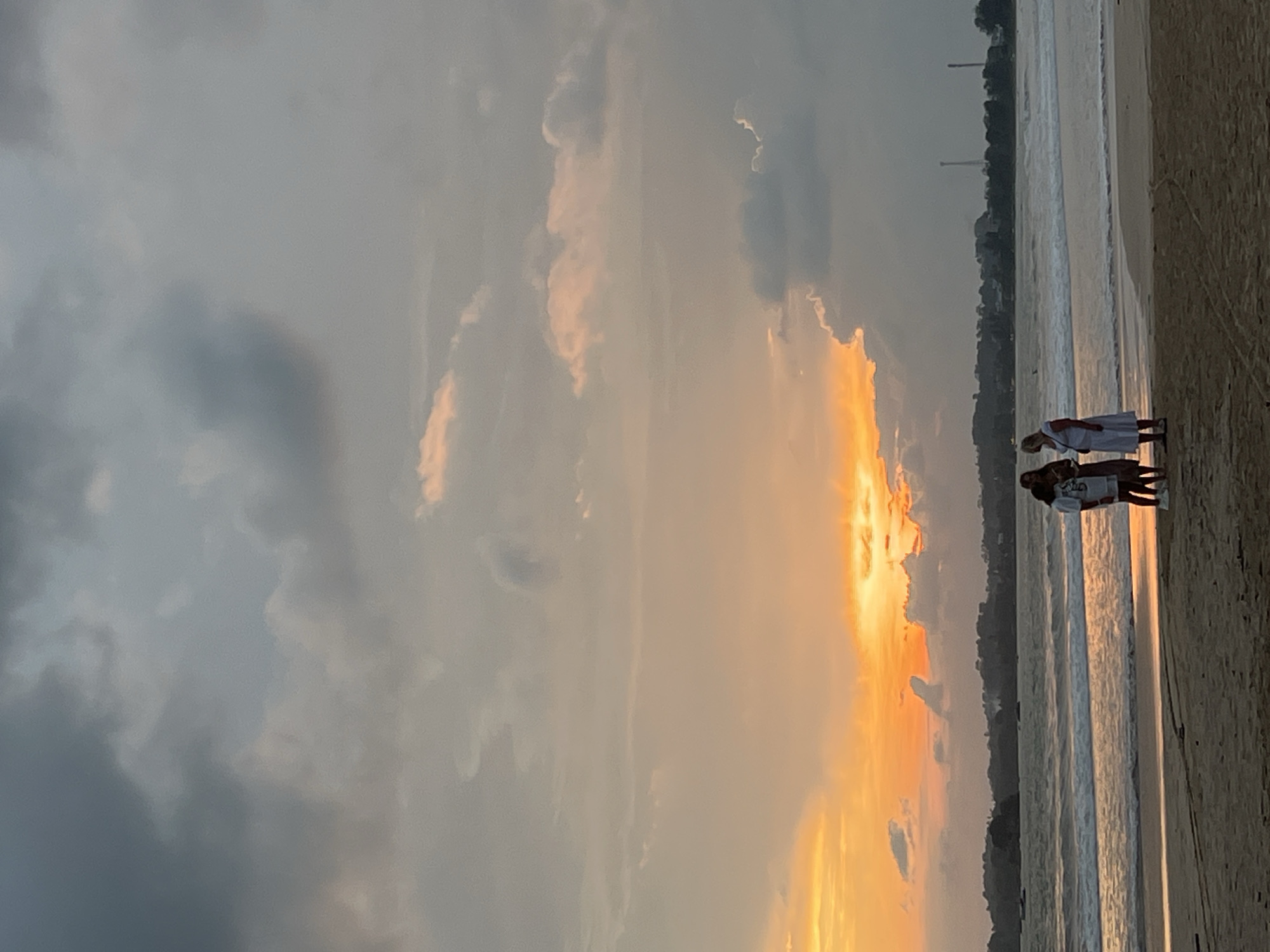Dramatic sunset documented at Peleana beach amid storm clouds
