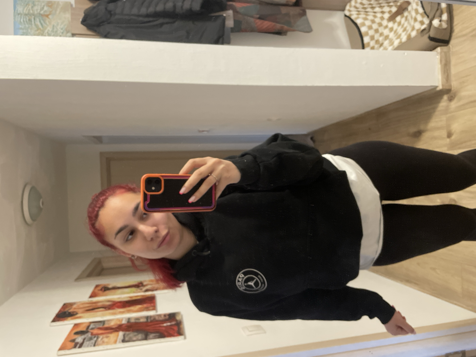 Woman takes mirror selfie in black athletic wear in Bulgaria
