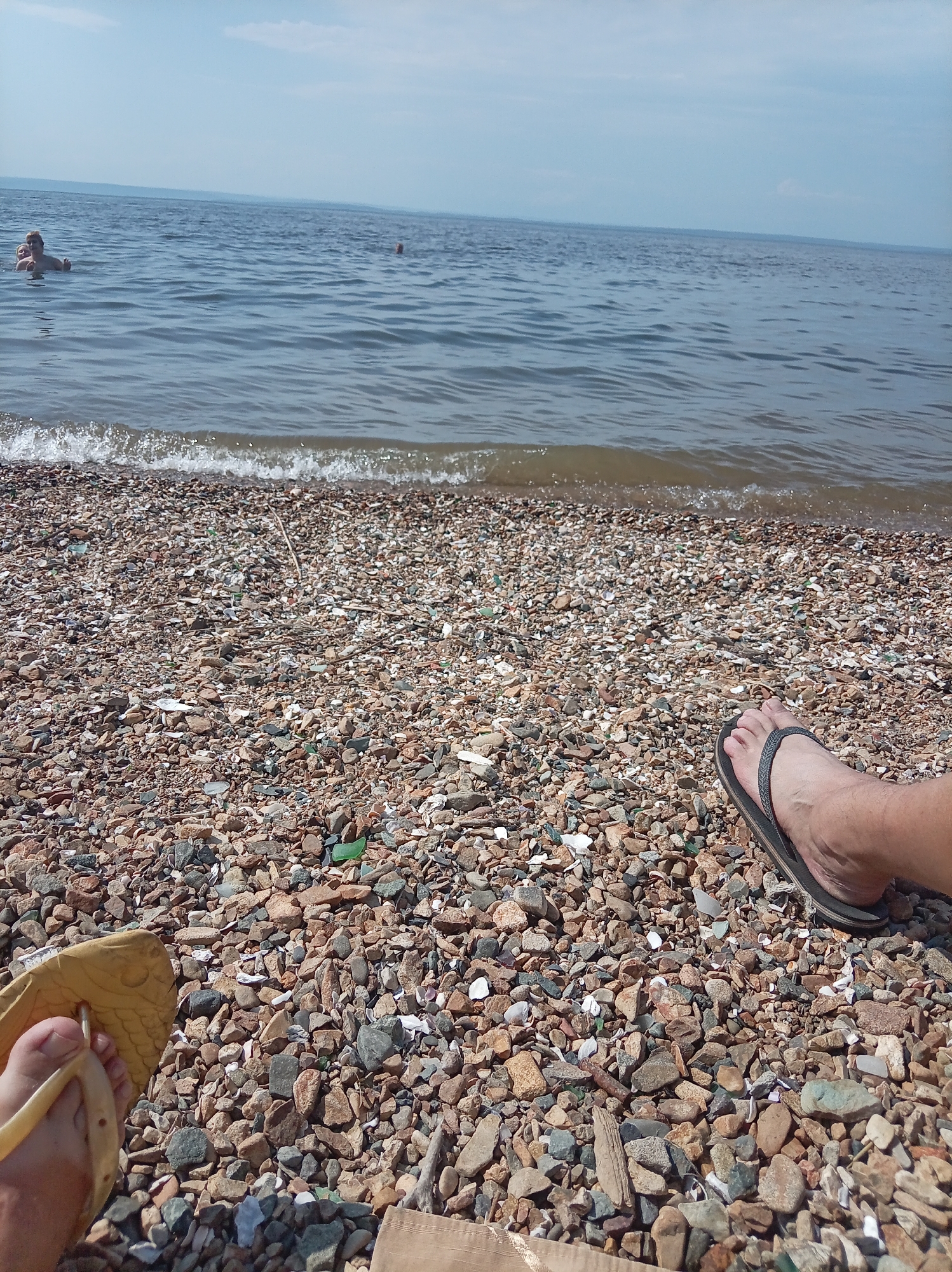 Summer swim day on a Vladivostok pebble beach