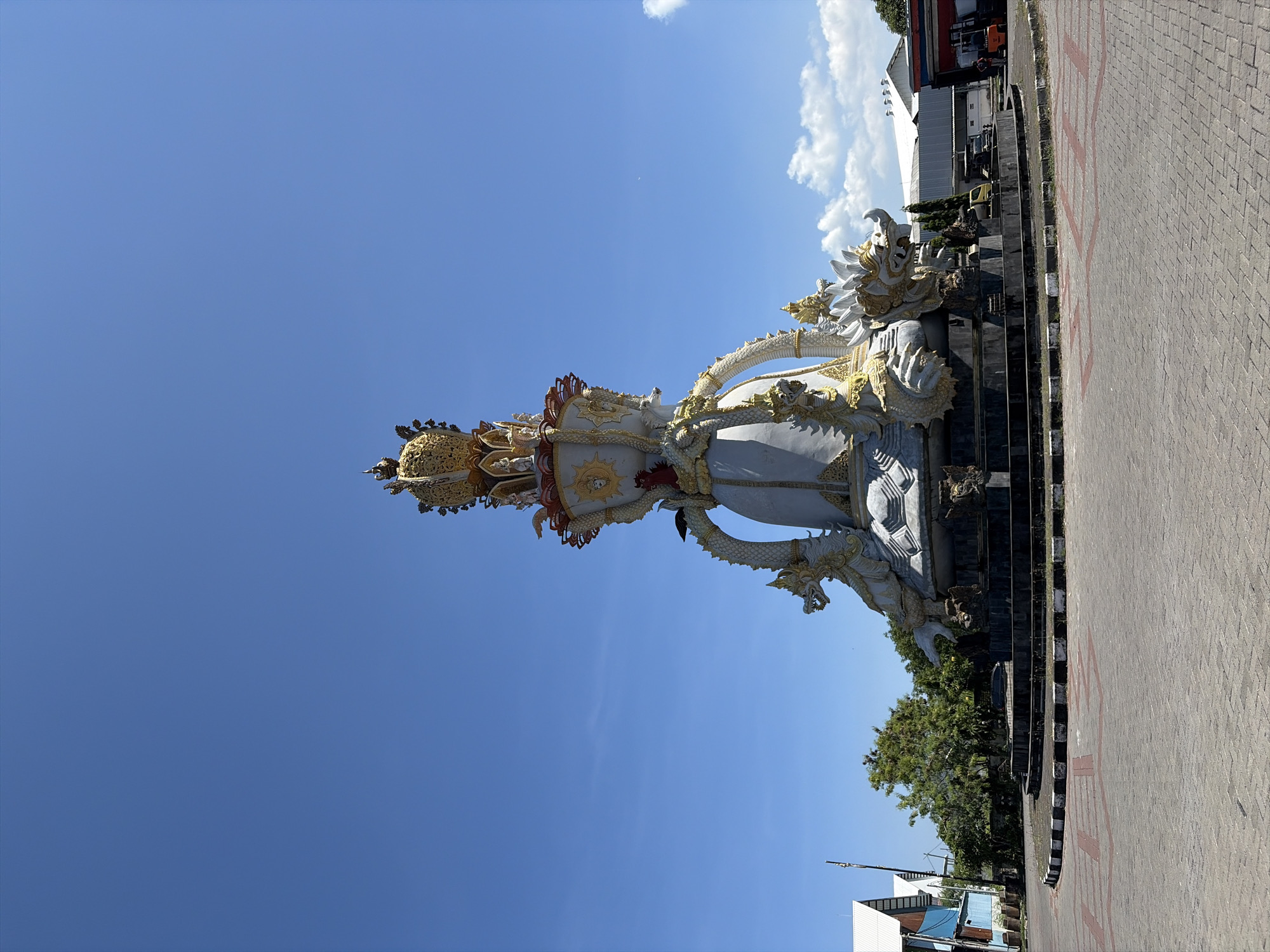Morning documentation of ornate statues and marina in Denpasar