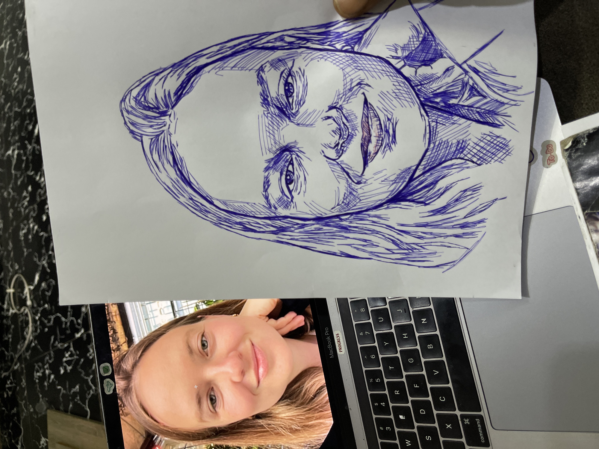 Portrait sketching session with laptop reference, Abuja