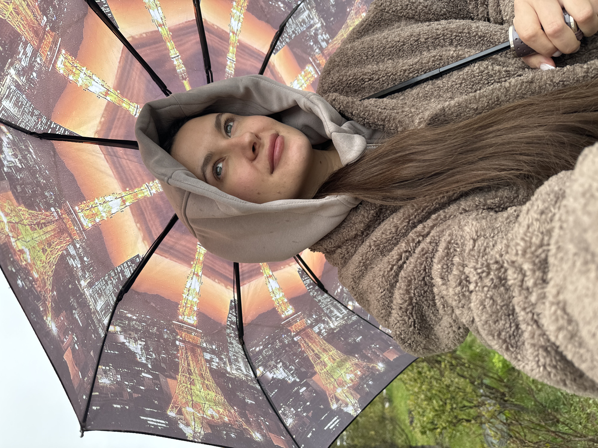 Woman with child walks in rain in Odintsovo