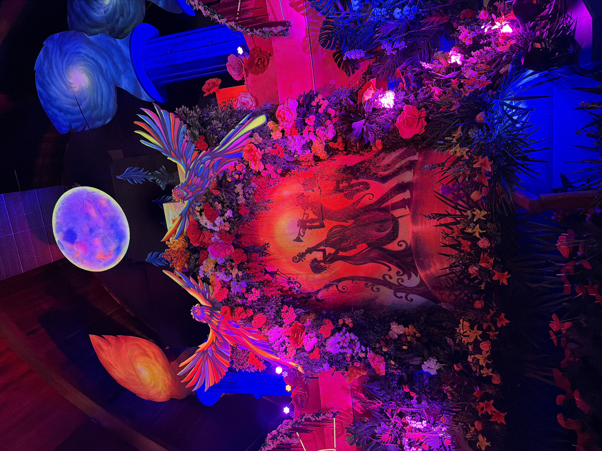 Colorful art installation with rainbow bird sculptures documented in Pomona