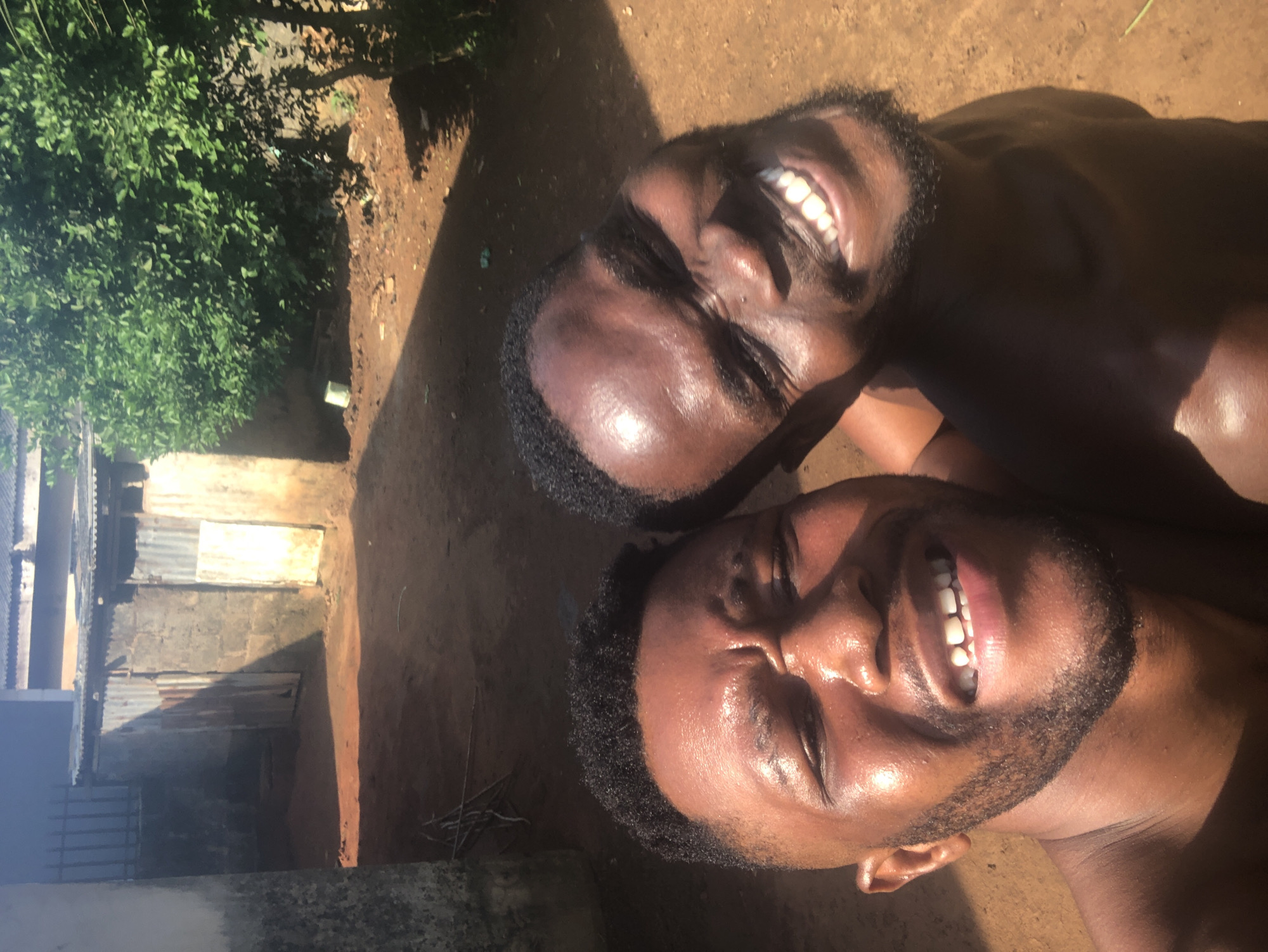 Men captured in joyful outdoor moments in tropical setting