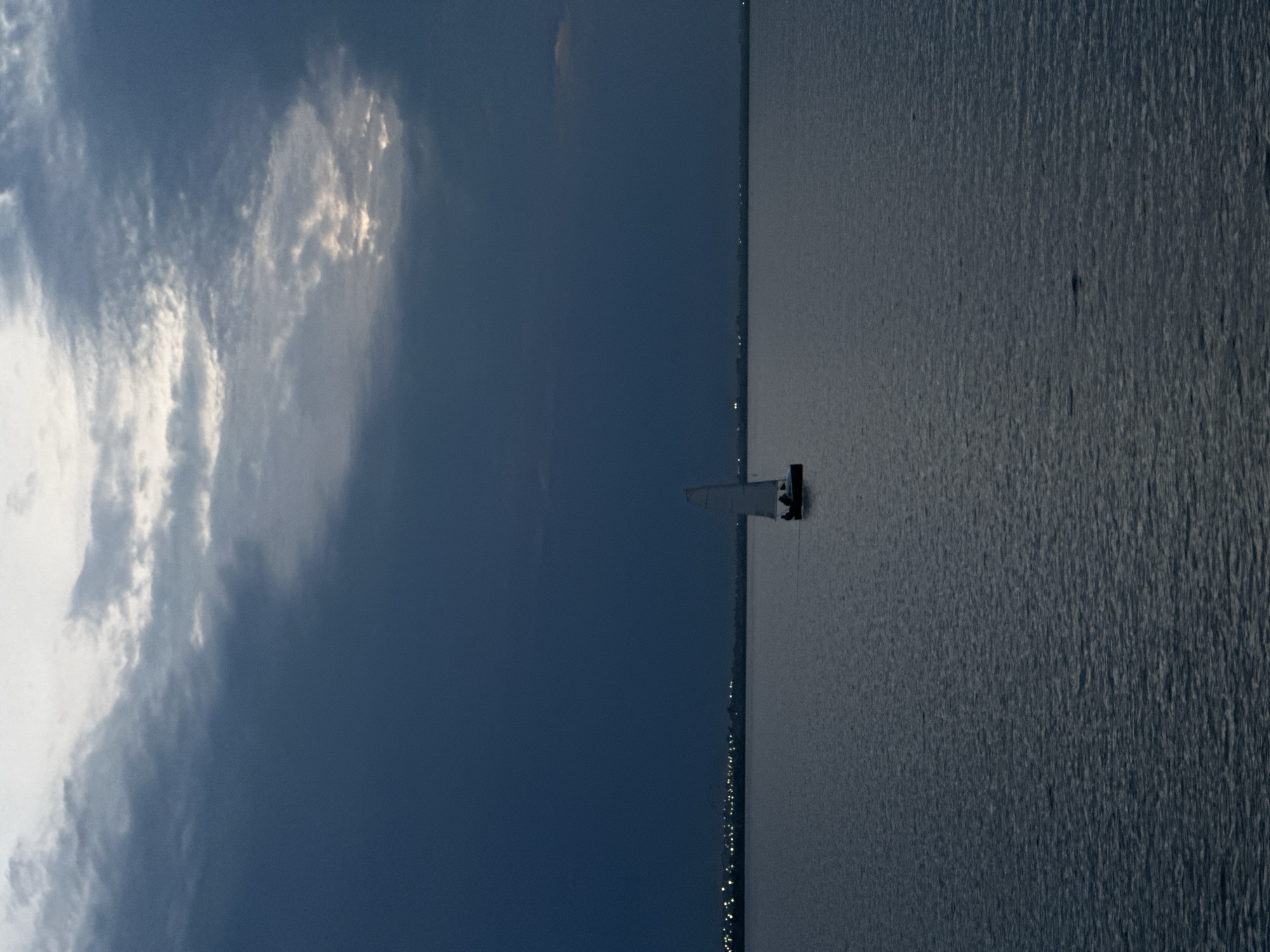 Sailboat on a Kokshetau lake at dusk