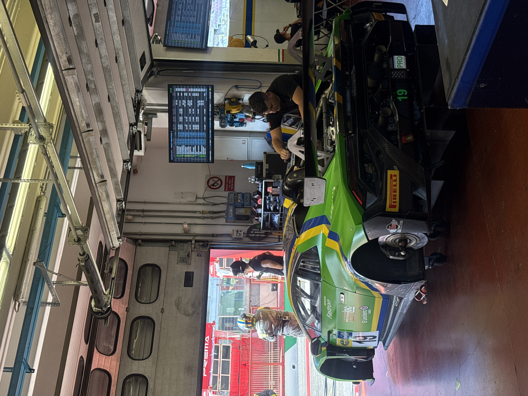 GT pit stop action at Mugello featuring Lamborghini and Ferrari race cars