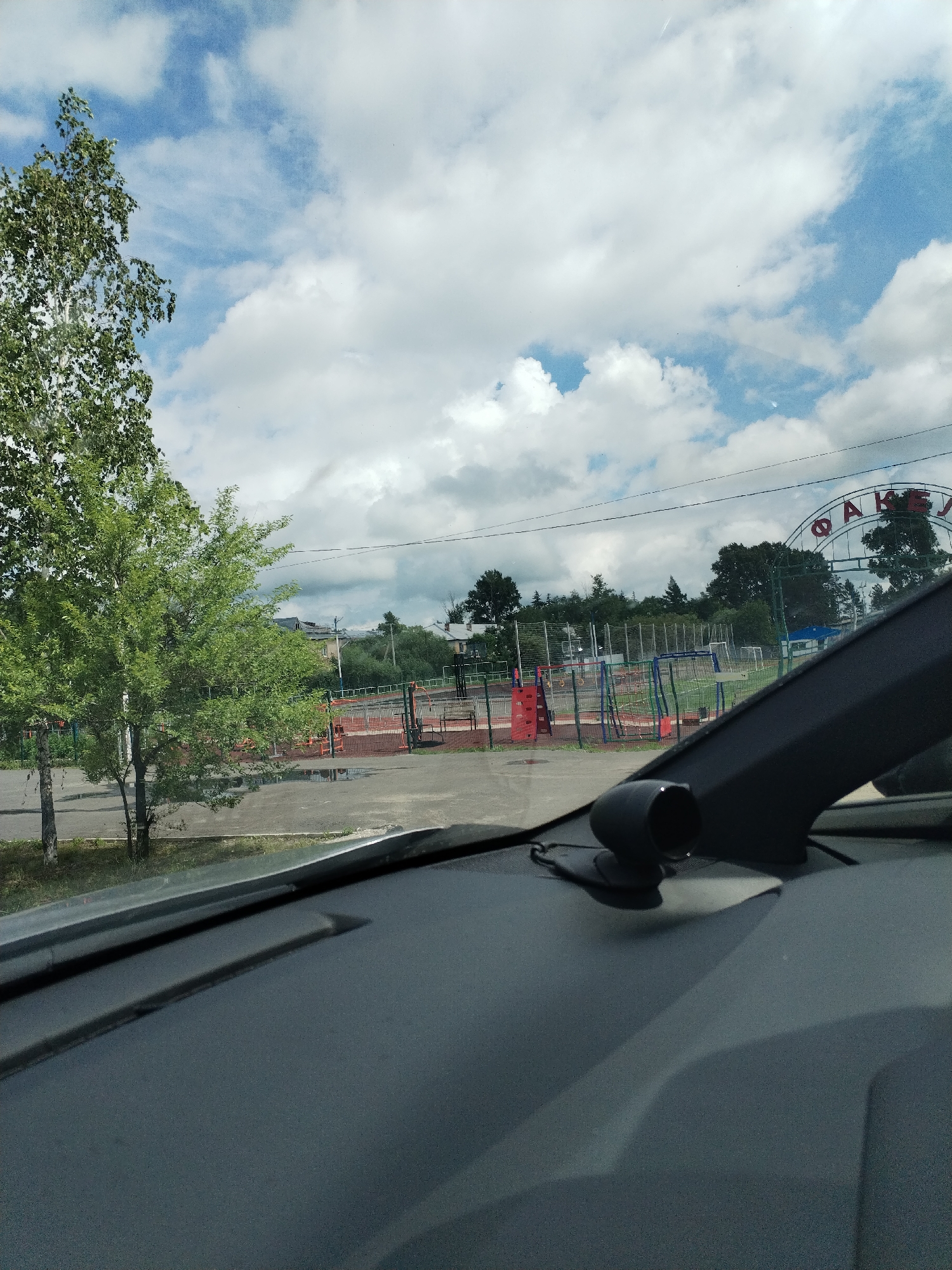 Road trip through overcast terrain, trains and crossings along the way