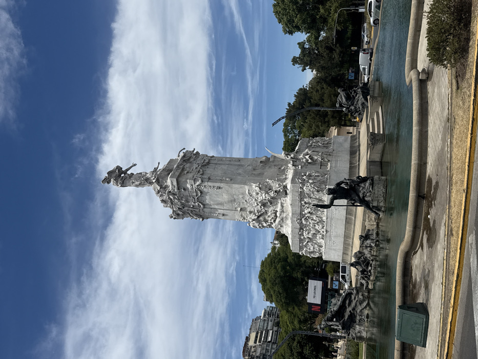 Tourist documents Buenos Aires architectural landmarks during afternoon exploration