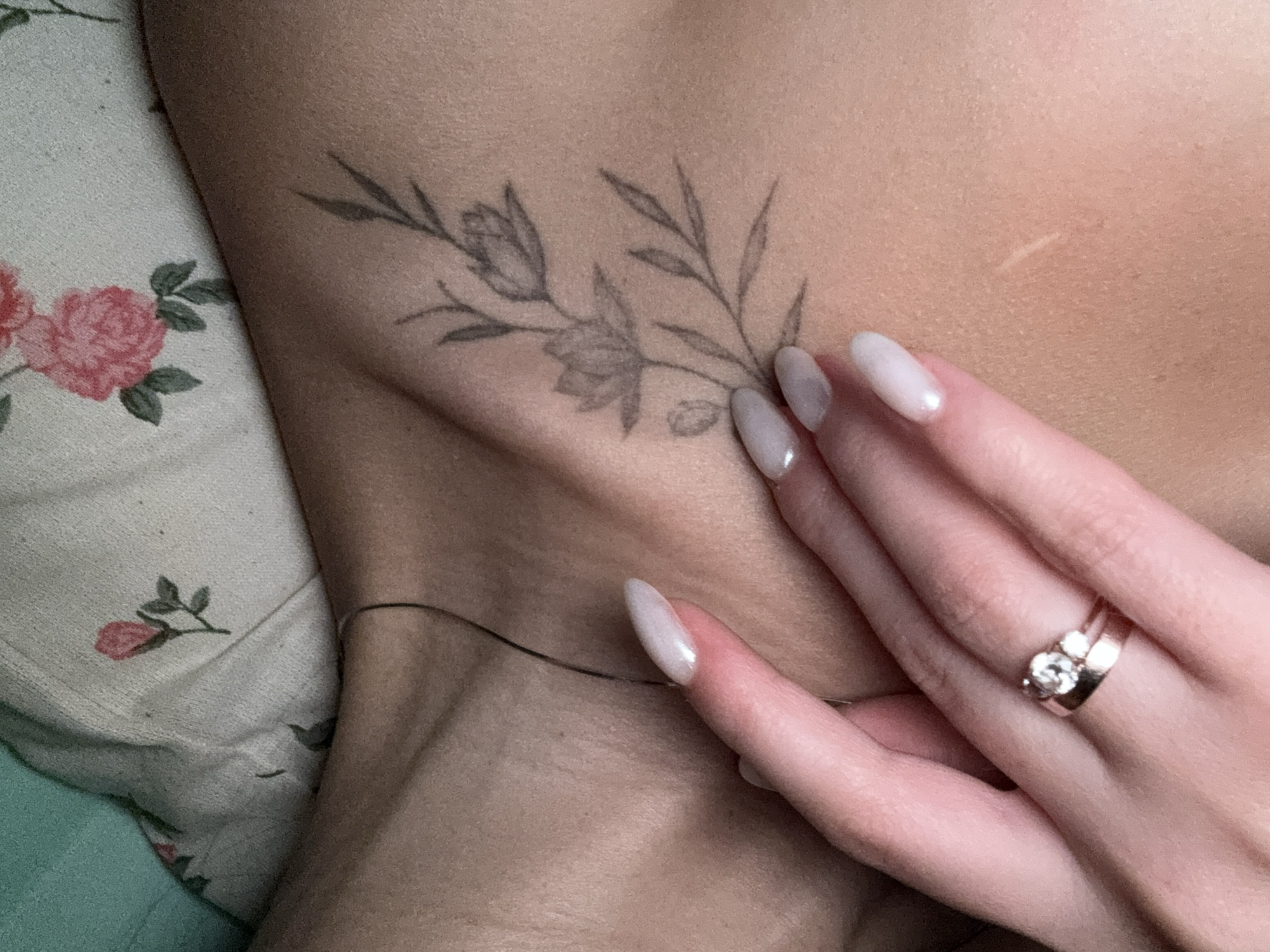 Person shows floral tattoo in portrait photo in Chaikovsky