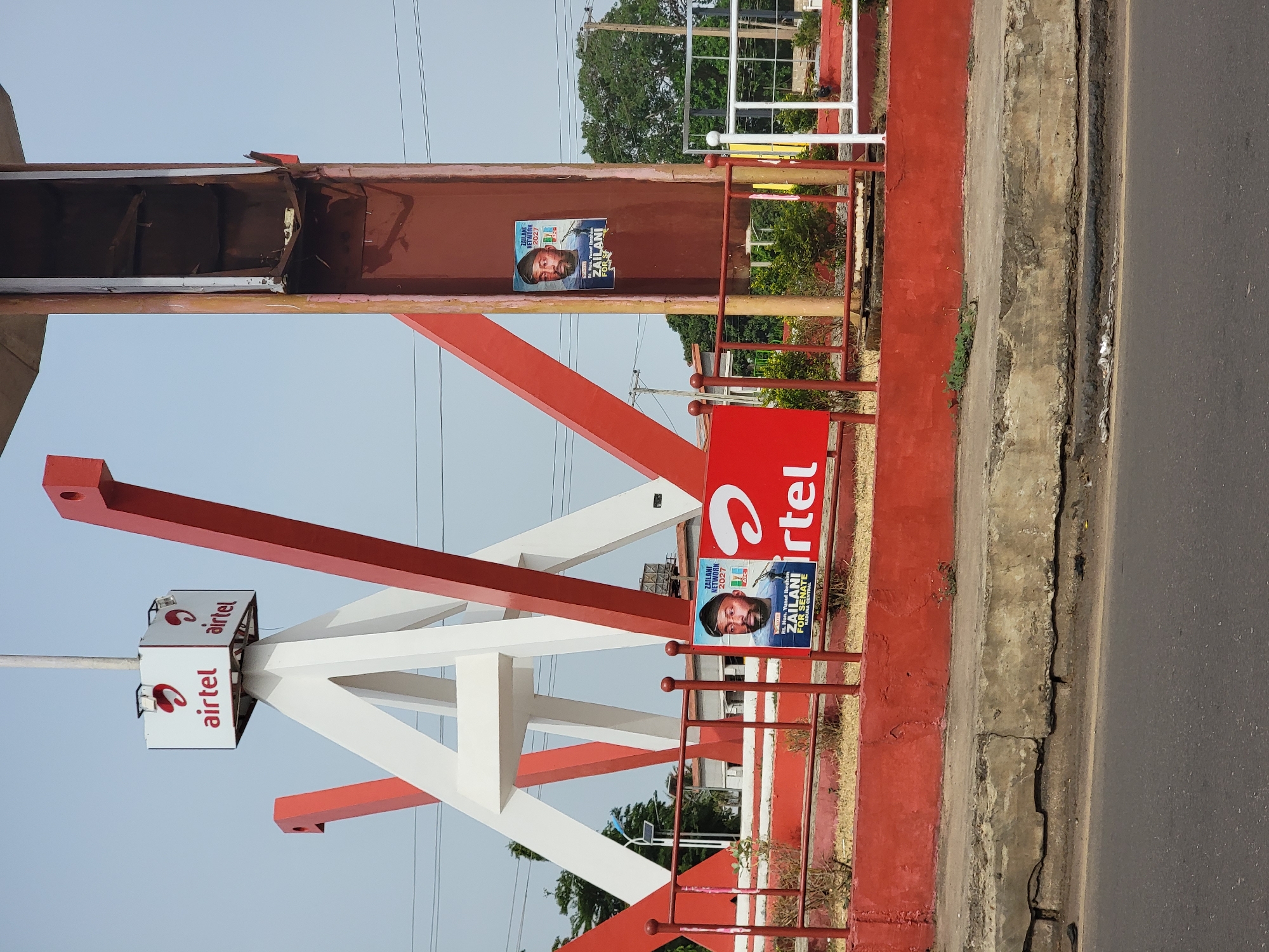 Airtel sign, political posters spotted roadside in Barnawa, Nigeria
