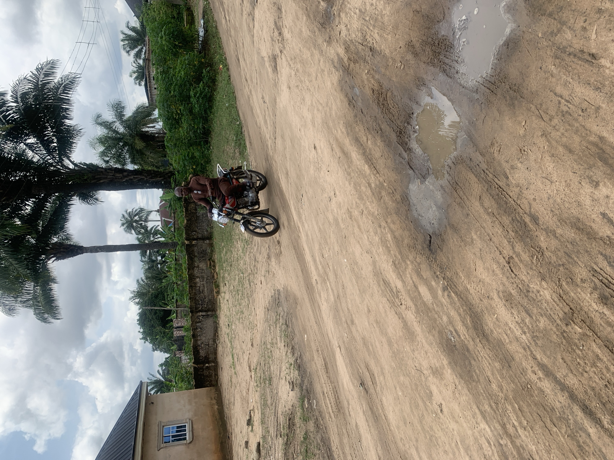 Daily life documented on dirt roads in Aba, Nigeria