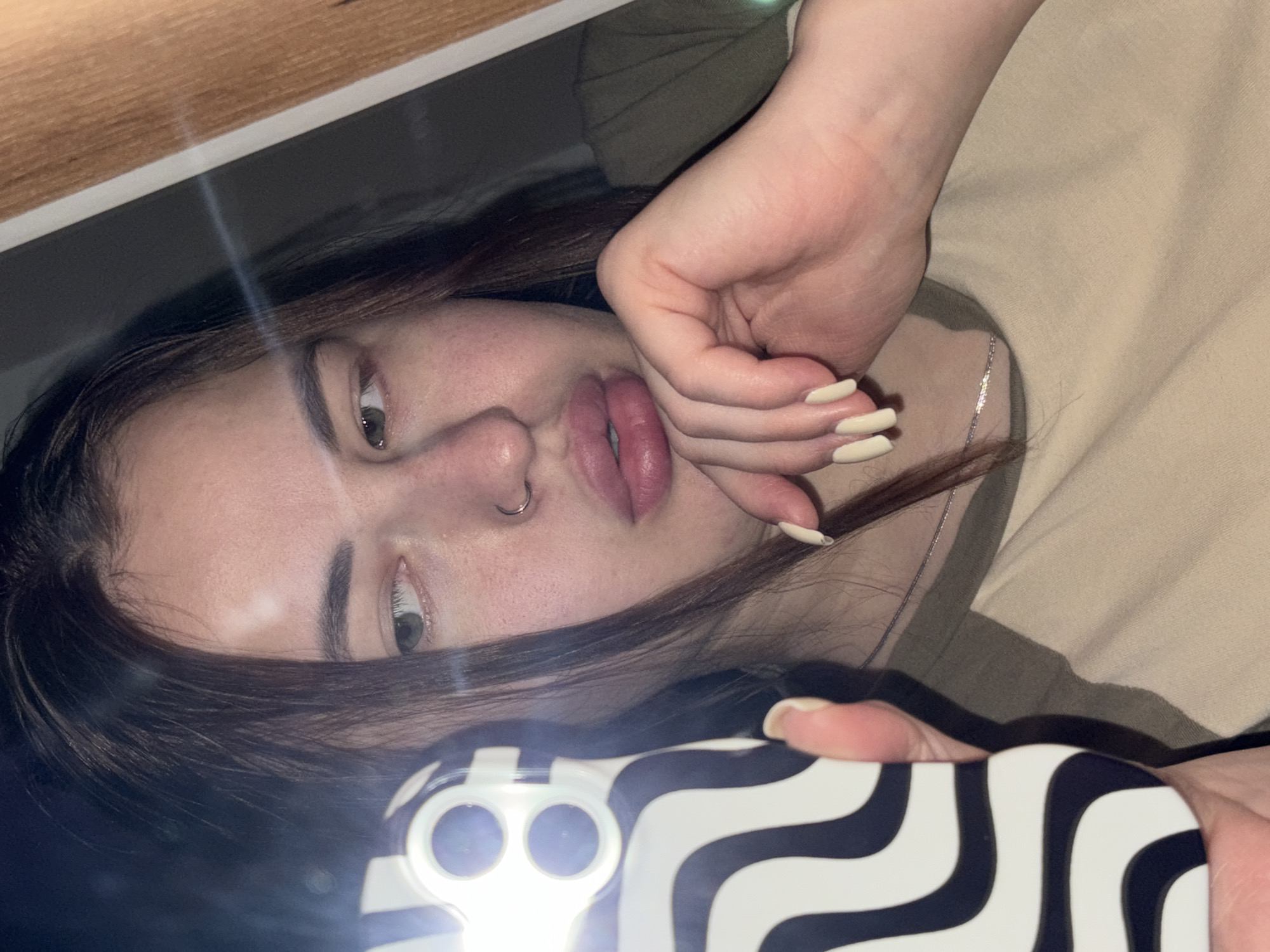 Woman takes selfie while lying down in Kaluzhskaya