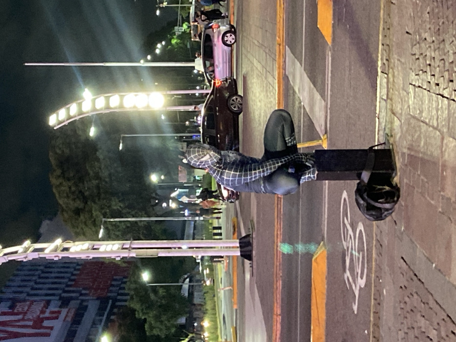 Costumed figure, historic buildings captured in Buenos Aires nighttime scenes