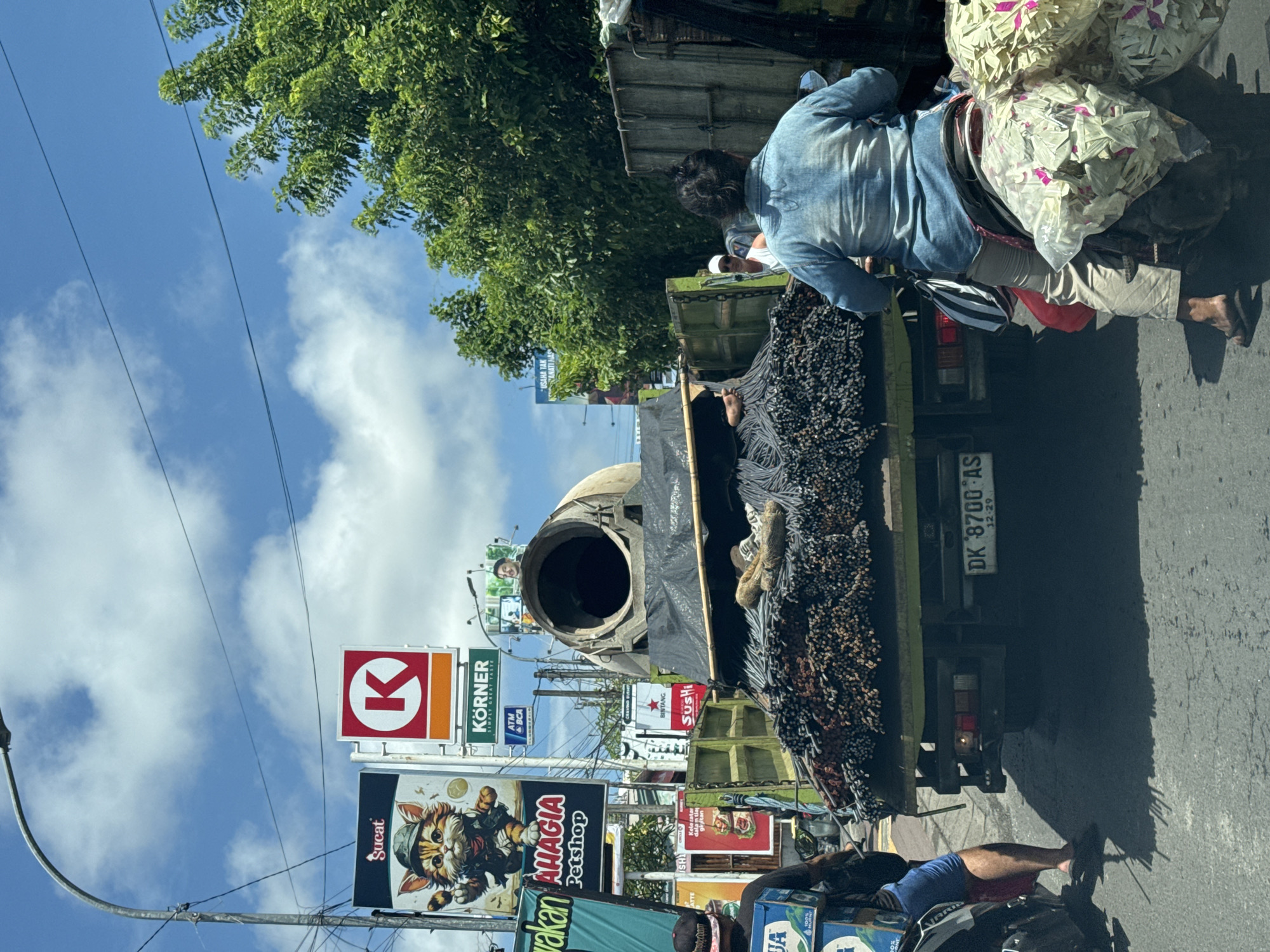 Construction truck carrying rebar observed in Kuta Selatan traffic