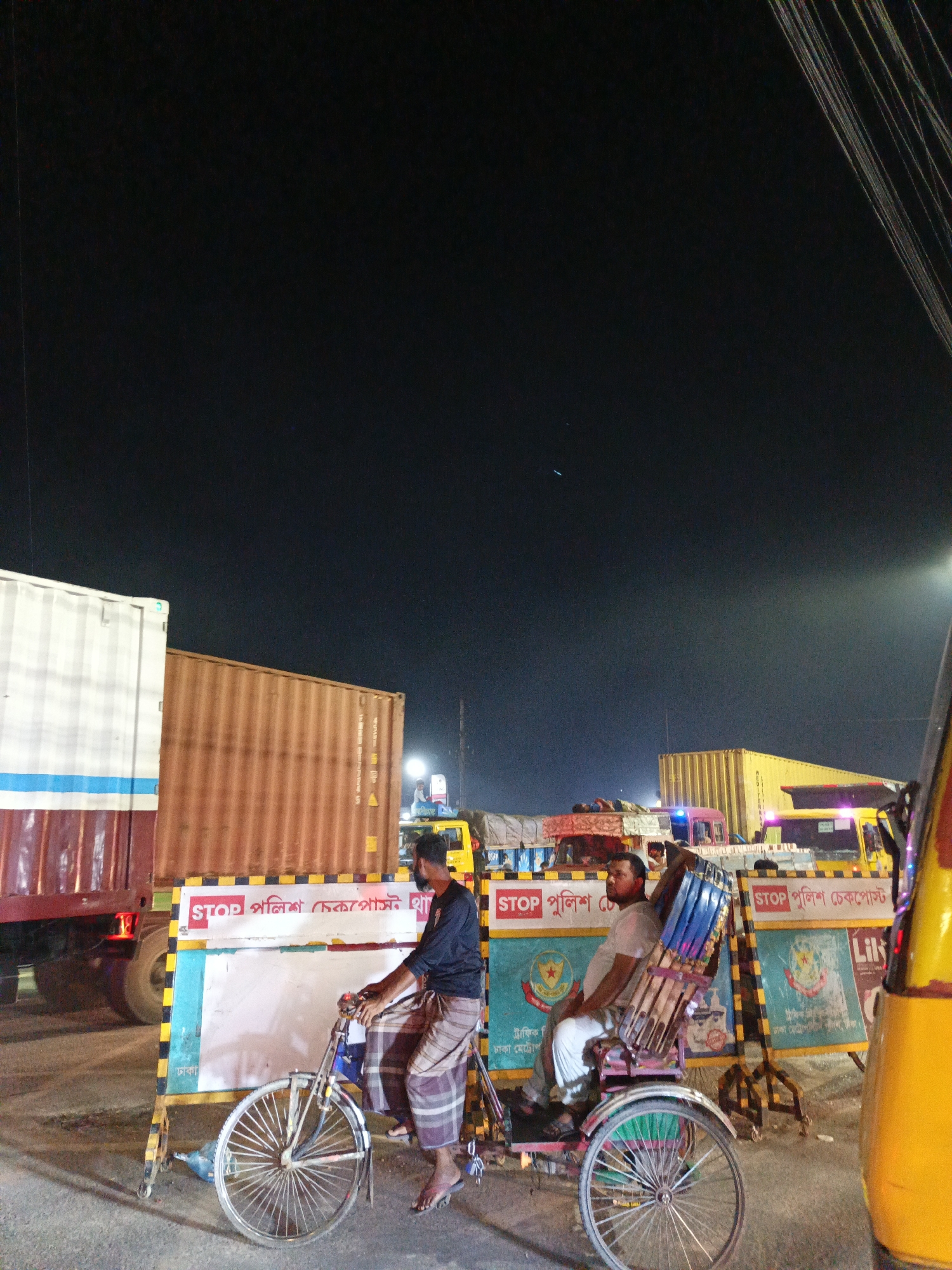 Nighttime urban life documented across South Asian city