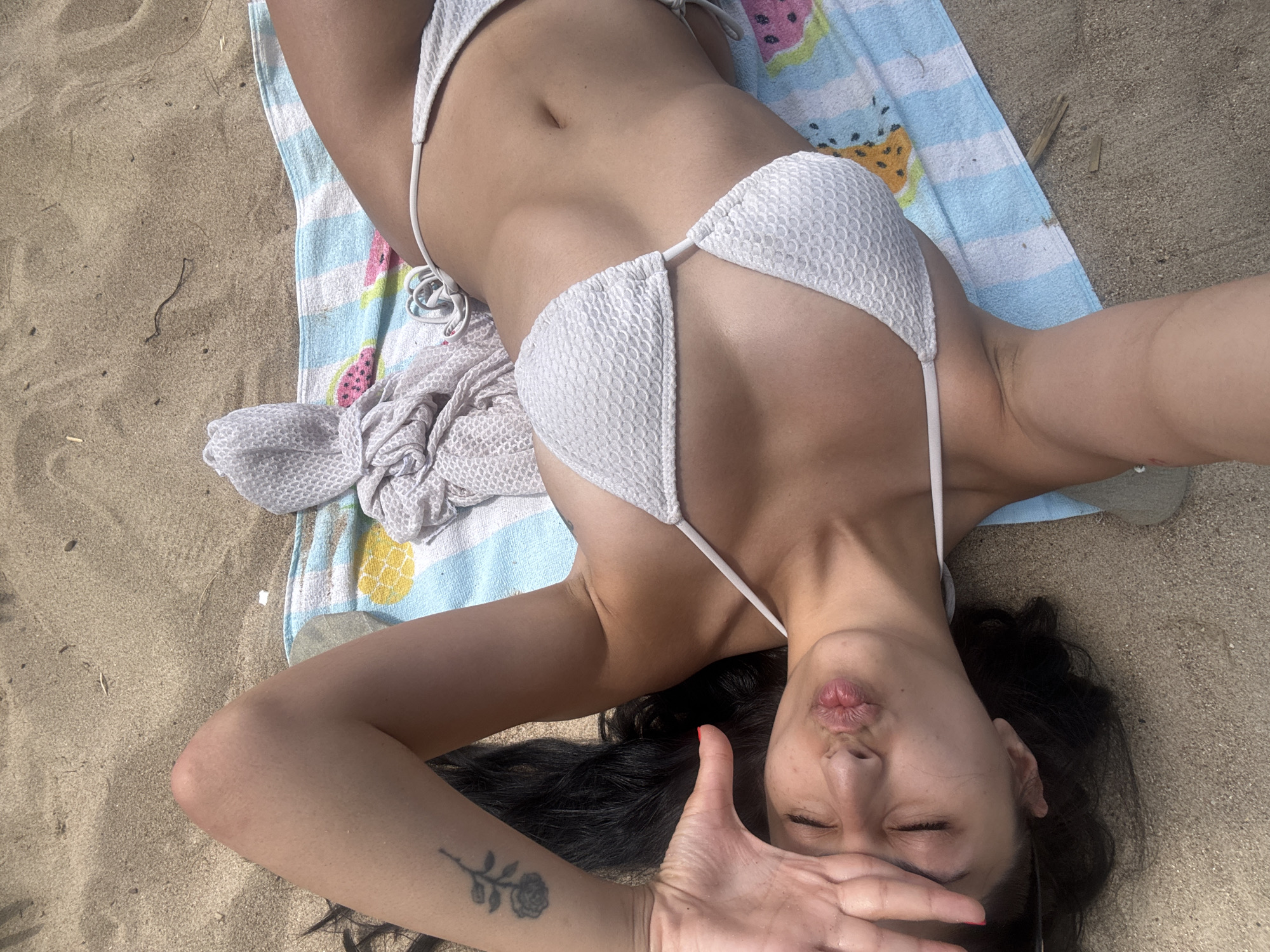 Woman enjoys morning beach time in Gialova, Greece