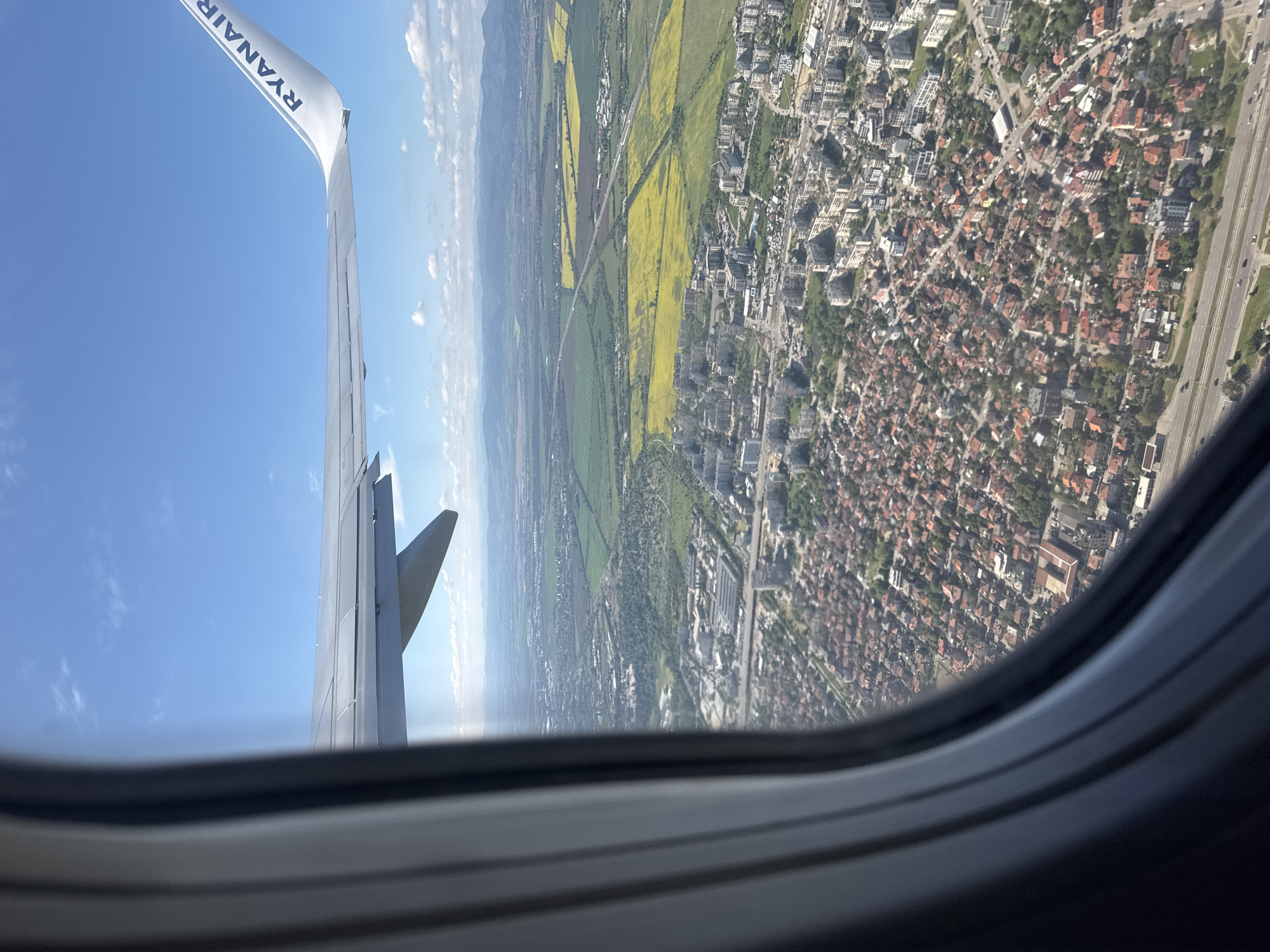 Sofia moments: airplane window view and driver's peace sign