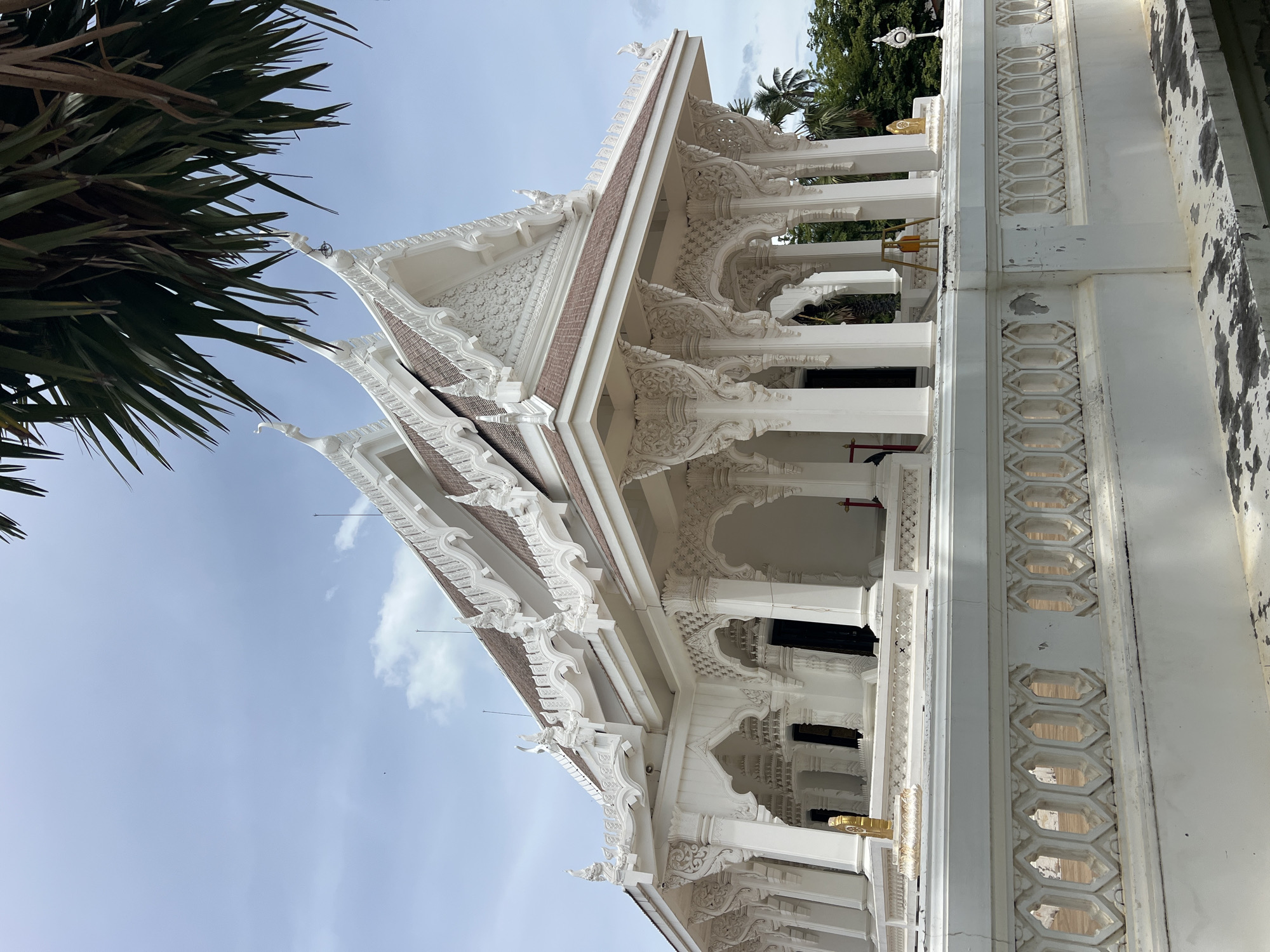 Inside a Koh Samui temple complex with mummified monk and ornate grounds
