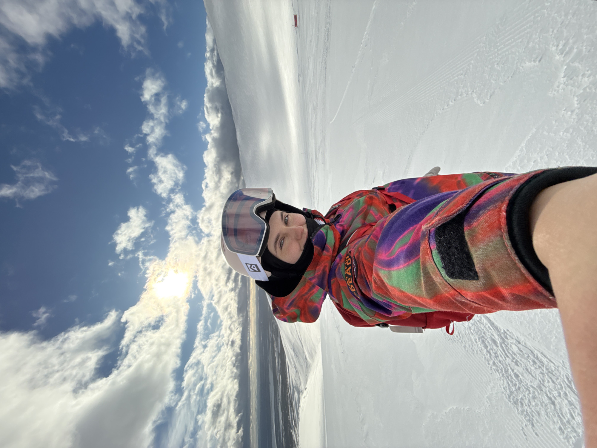 Skier takes multiple selfies on Kirovsk slopes during sunny day
