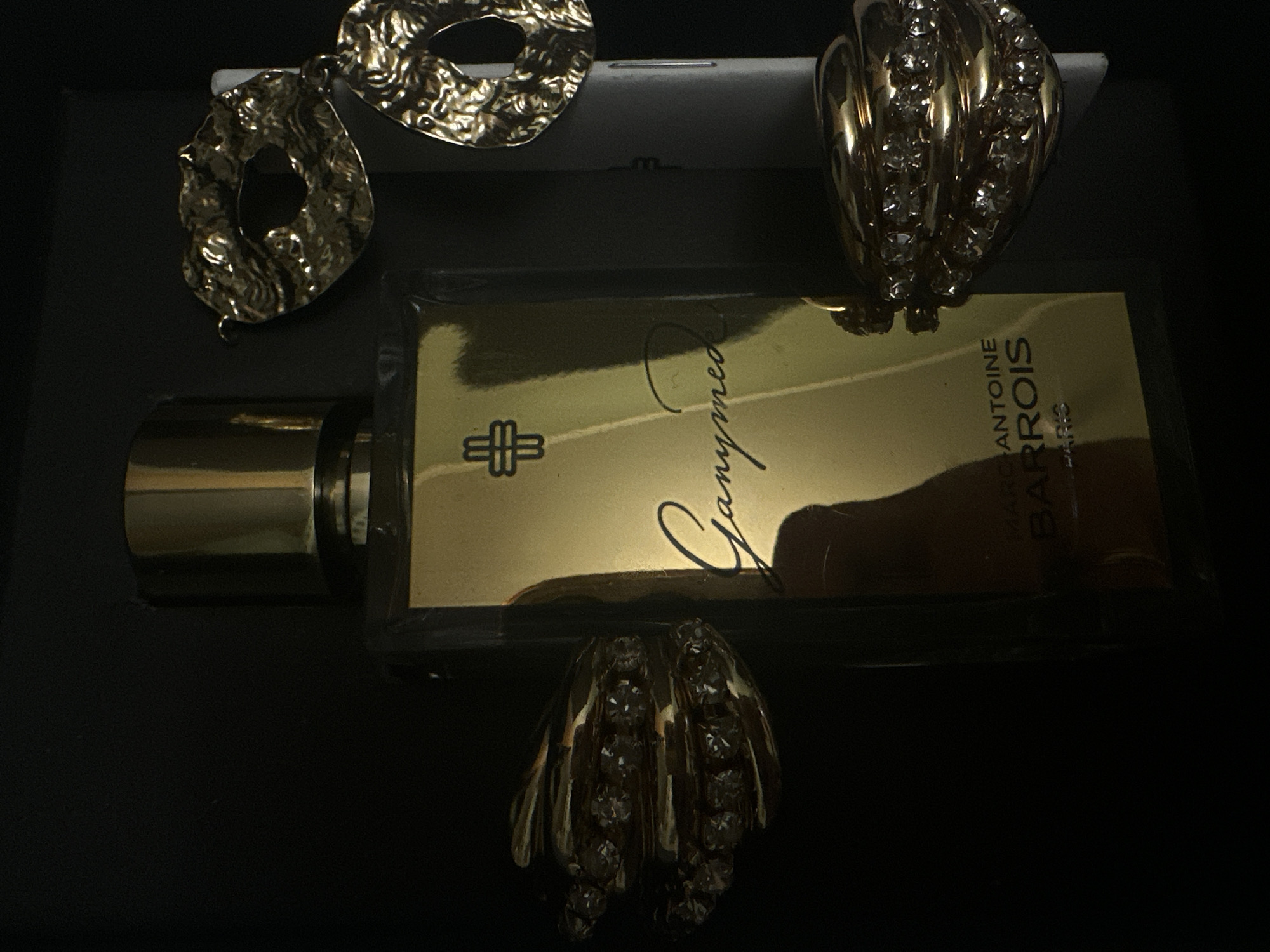 Luxury cosmetics display documented in Riga featuring designer perfume, jewelry