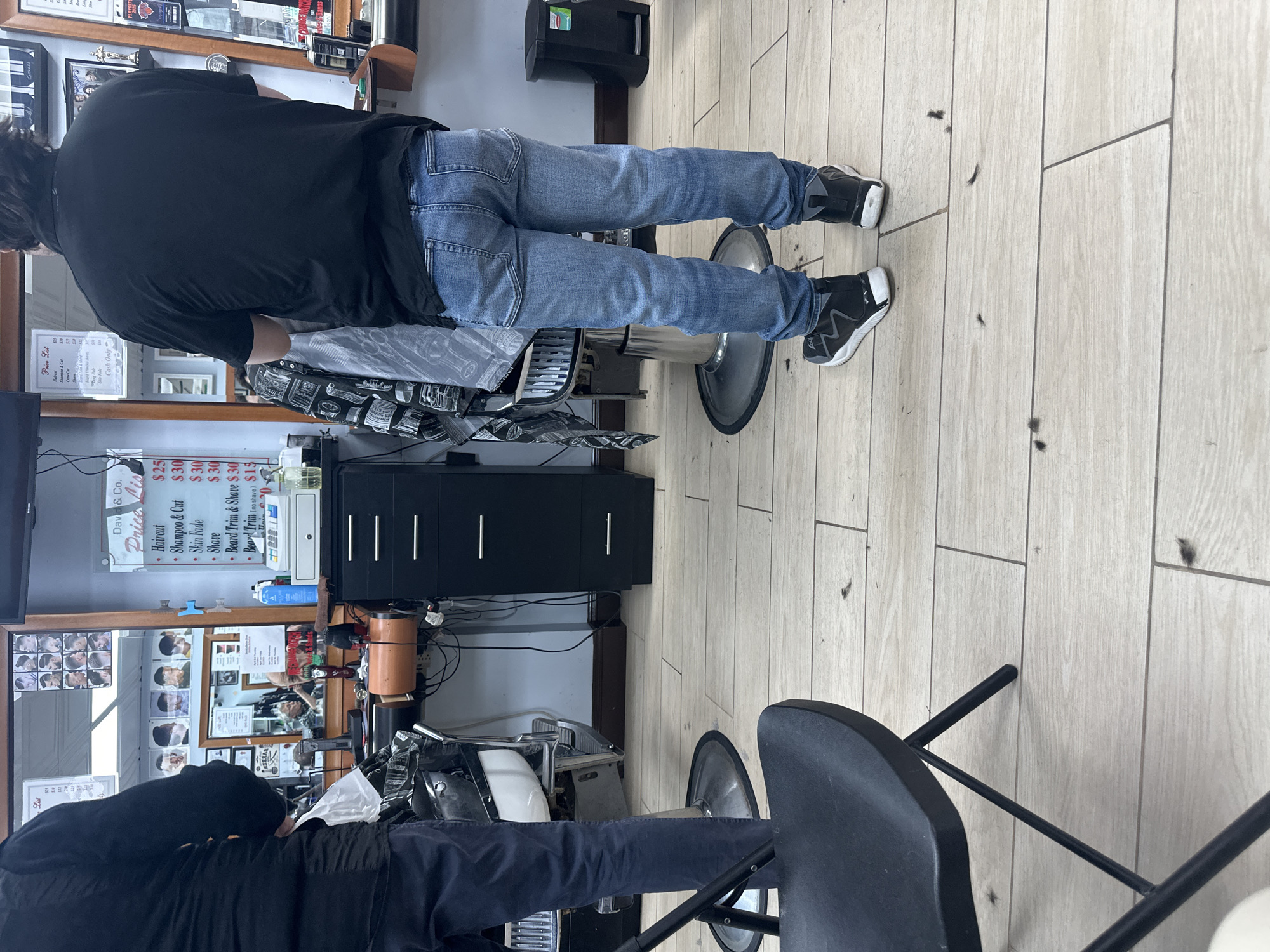 New Yorkers go about daily routines at barbershop and cafe