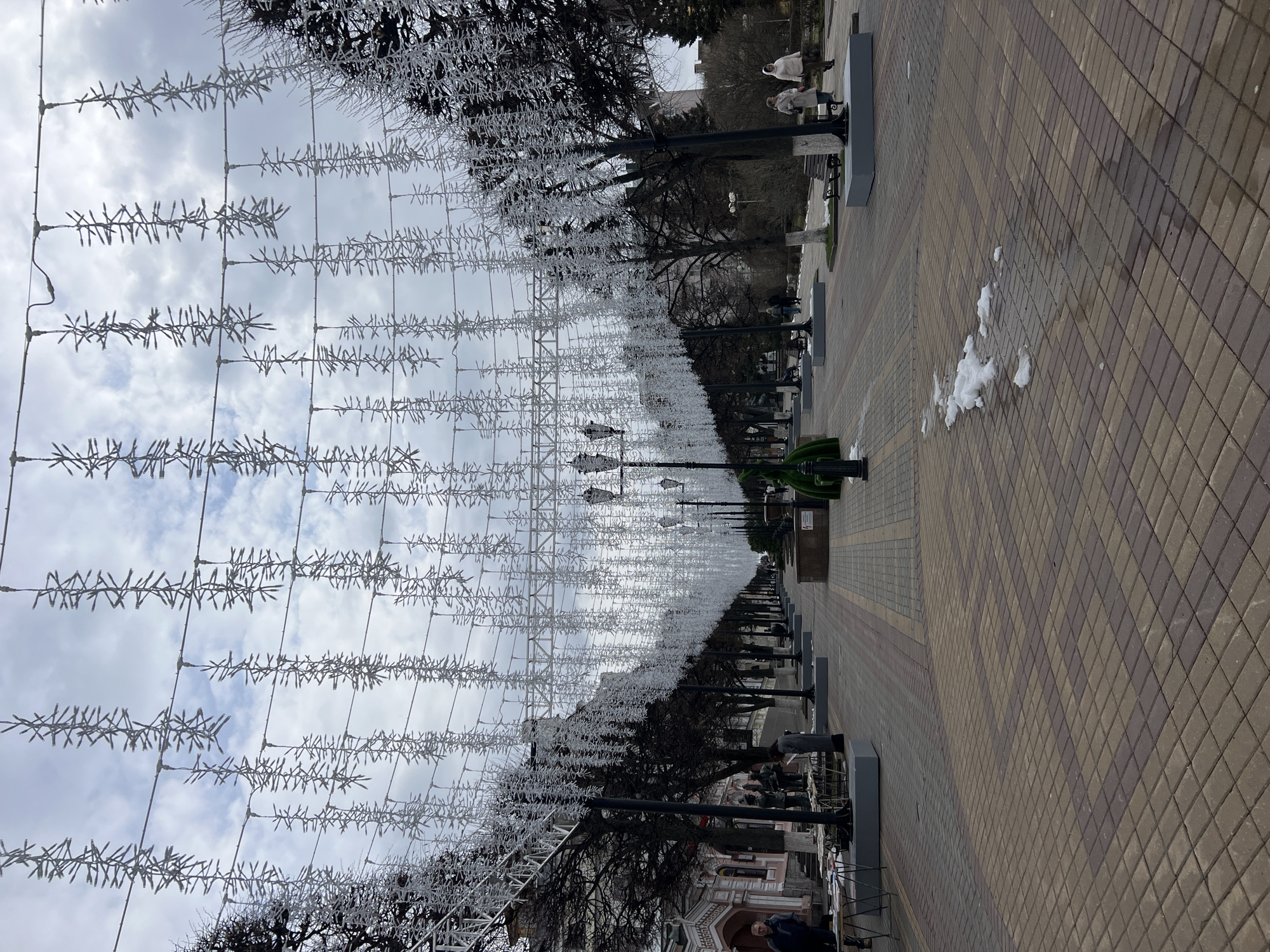 Pedestrians enjoy outdoor spaces in overcast Cheboksary