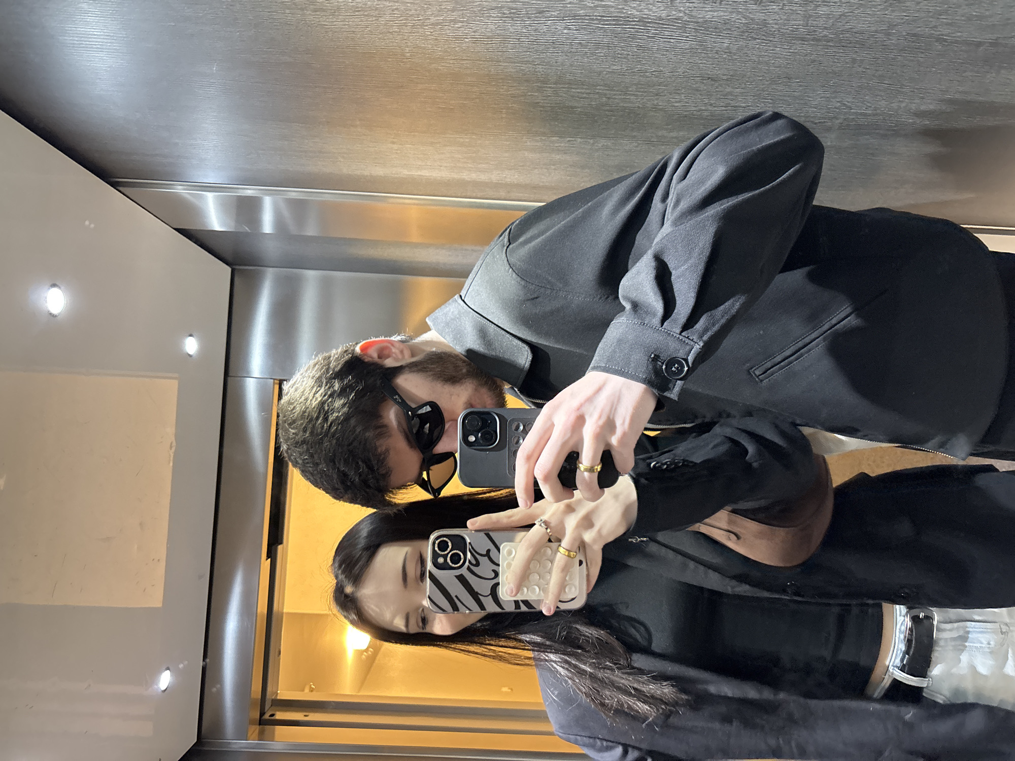 Couple takes selfies in elevator in Cachan, France