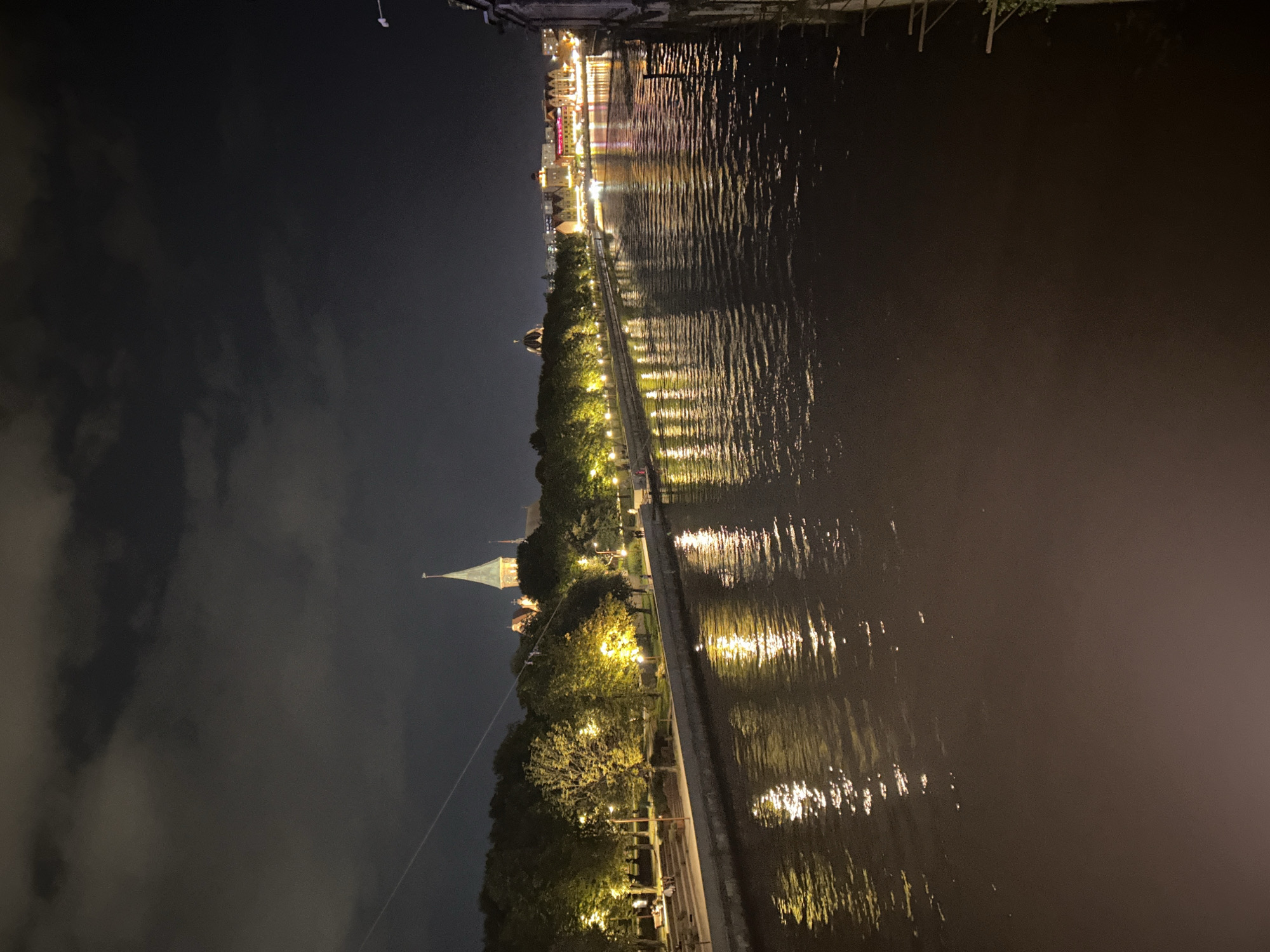 Kaliningrad at night: river reflections and a lit fountain