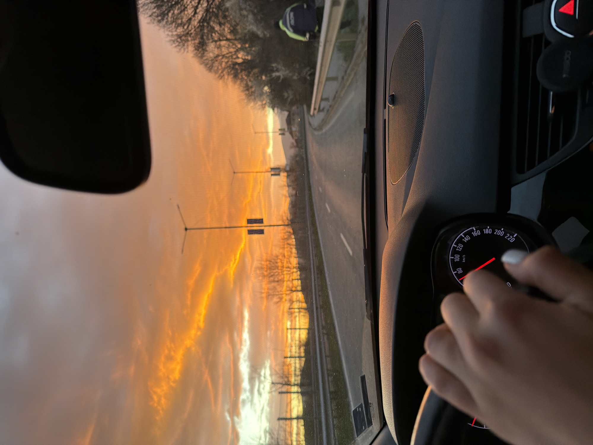 Motorist photographs sunrise scenery on Bulgarian road near Pernik