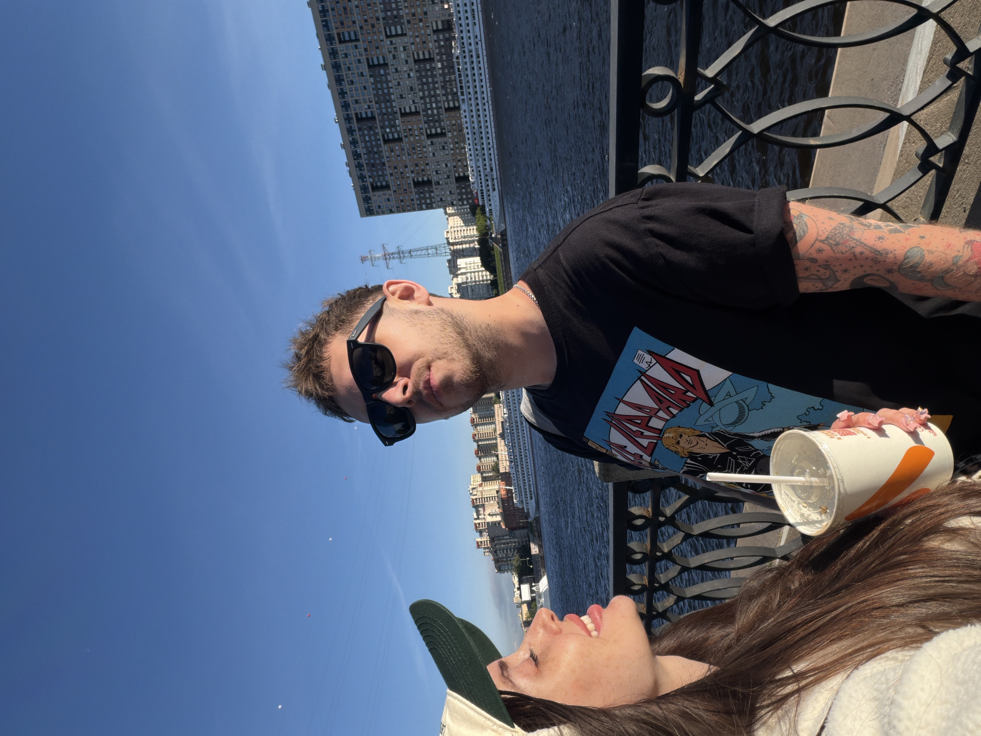 Couple enjoys waterfront view with ship in Shushary