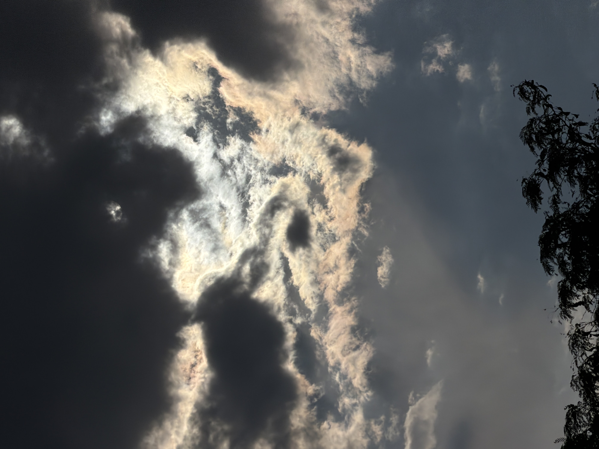 Sun breaking through dramatic cloud cover over Chirchik