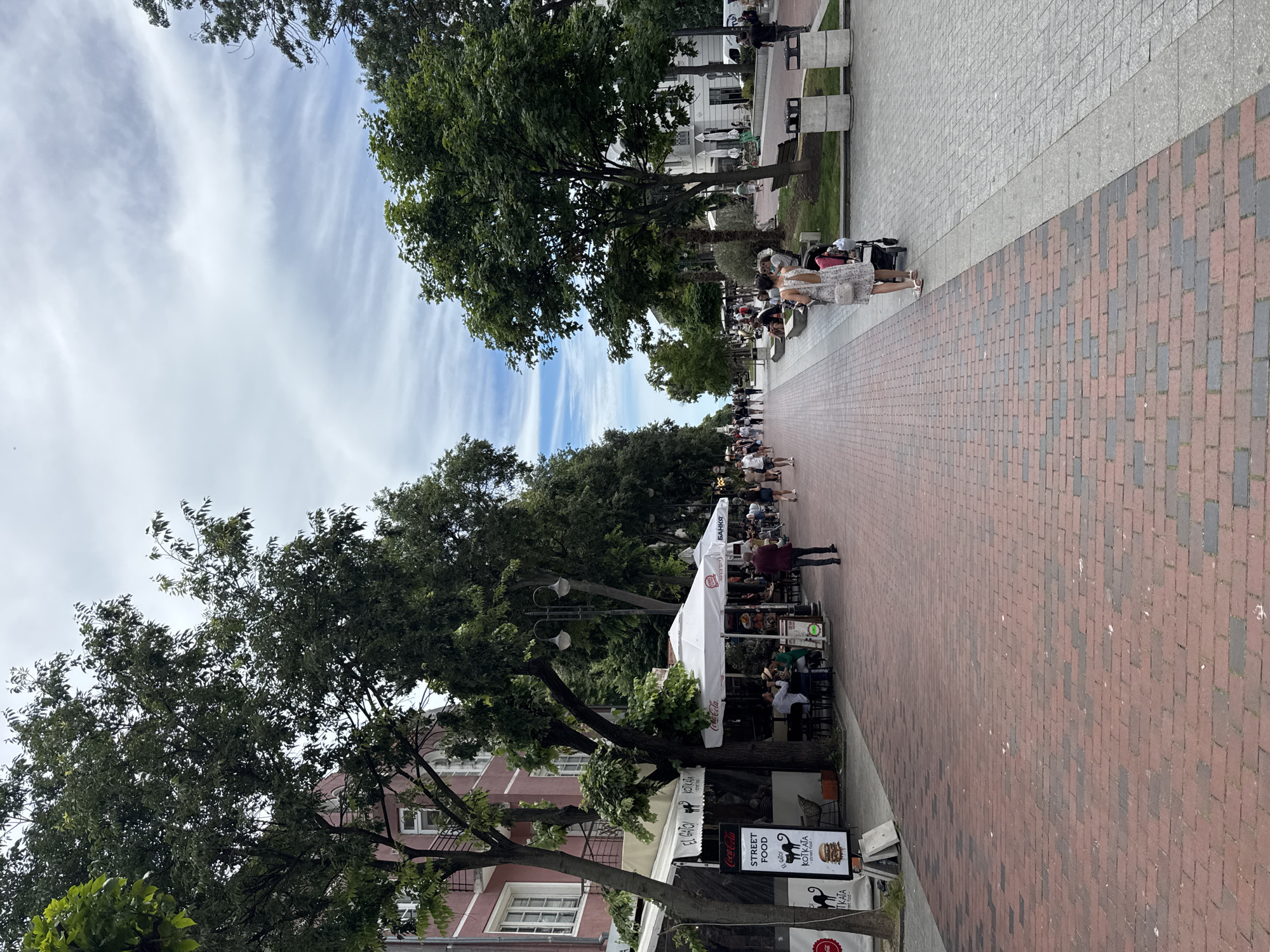 Morning café scene on Varna's pedestrian street, seagulls included