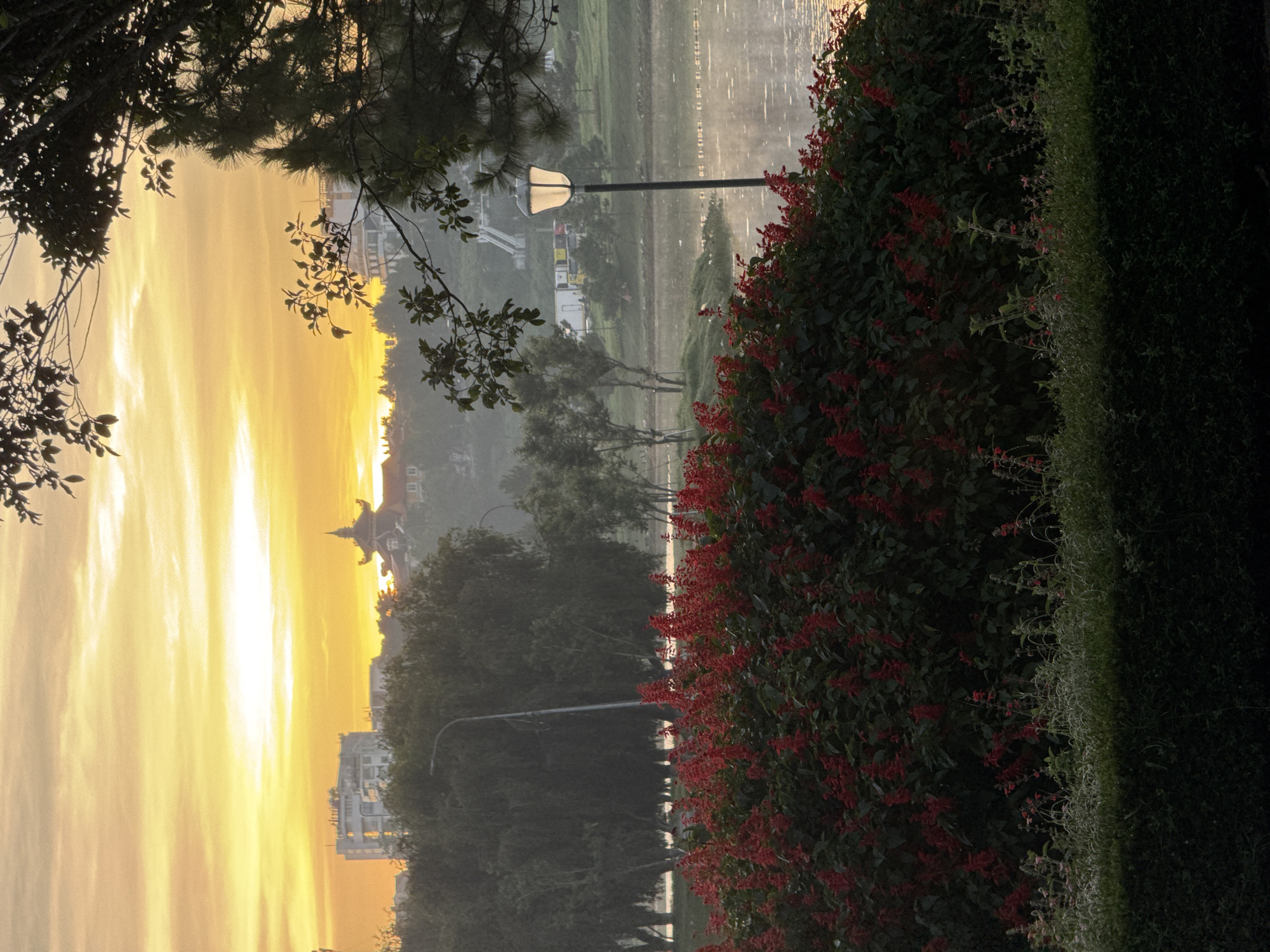 Cyclists and runners circle Xuan Huong Lake at dawn