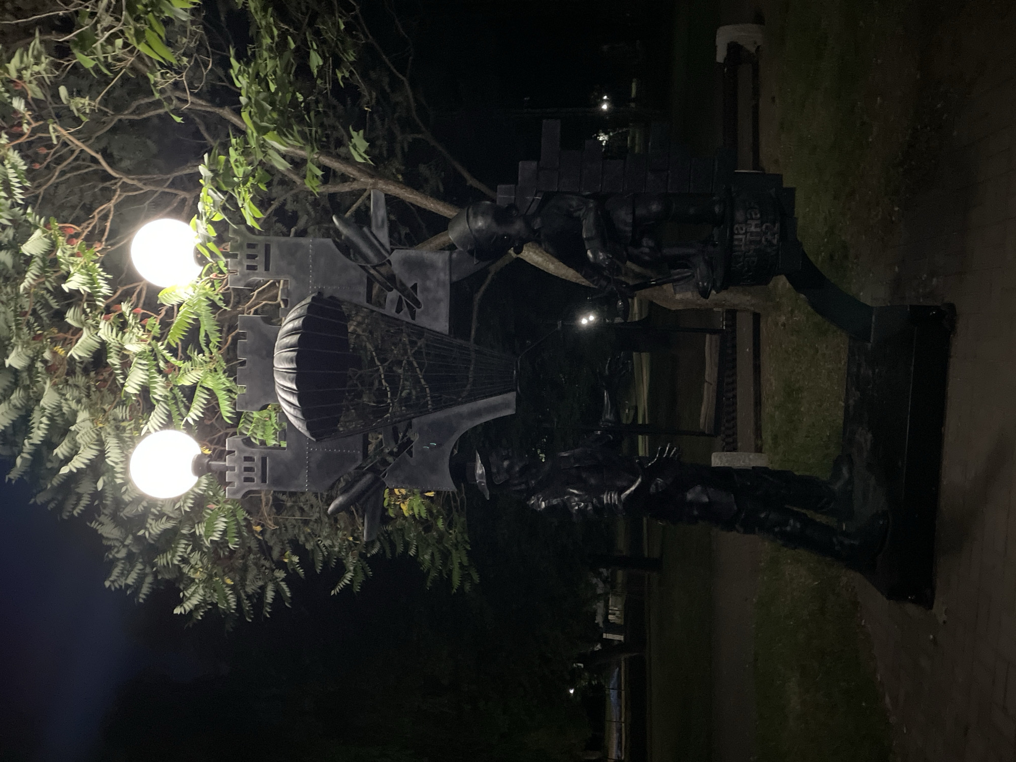 Evening stroll through a lit memorial park in Brest